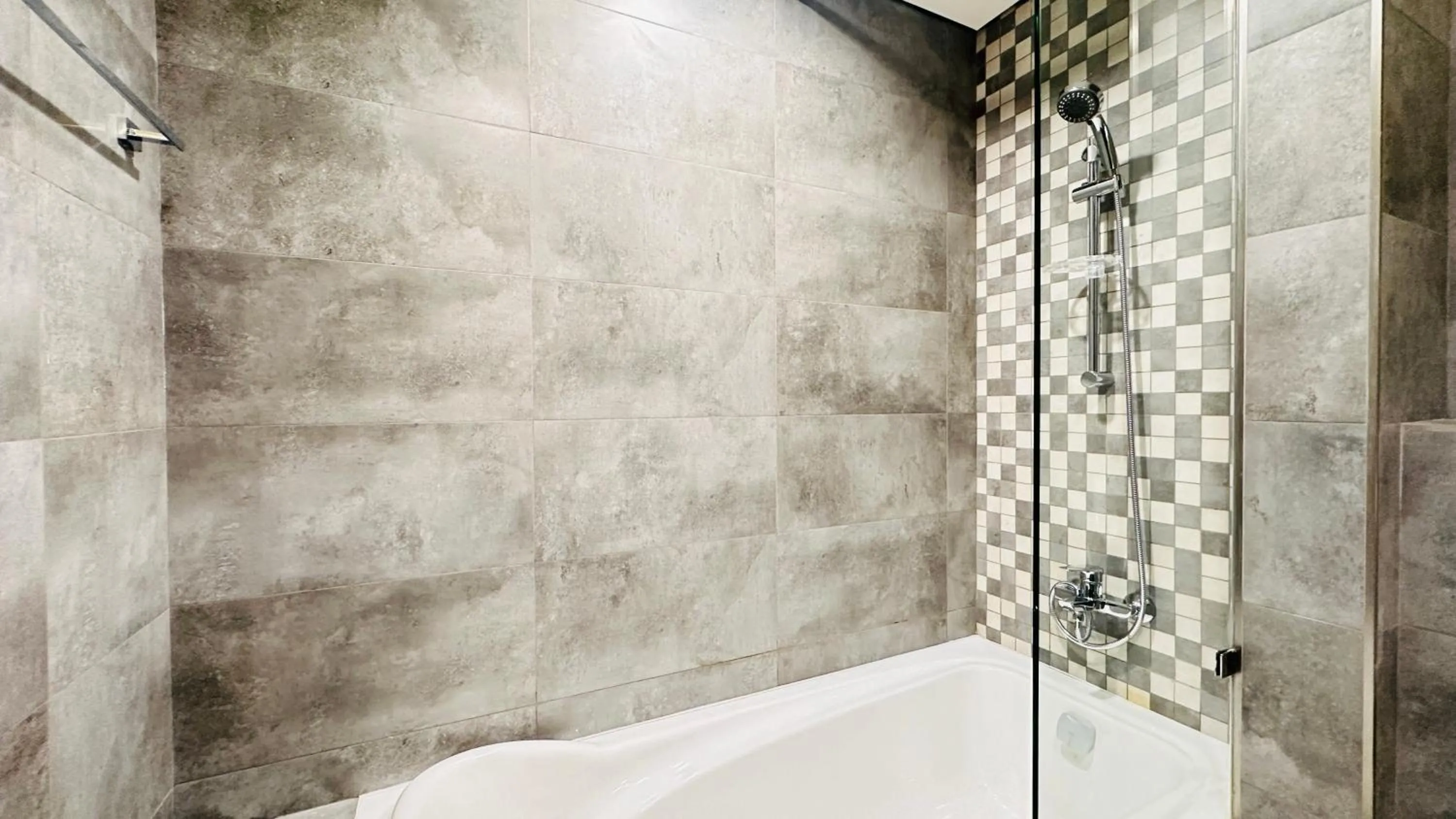 Bathroom in Upscale Apartment at Oval Tower Near Downtown with Balcony and Parking by Belvilla