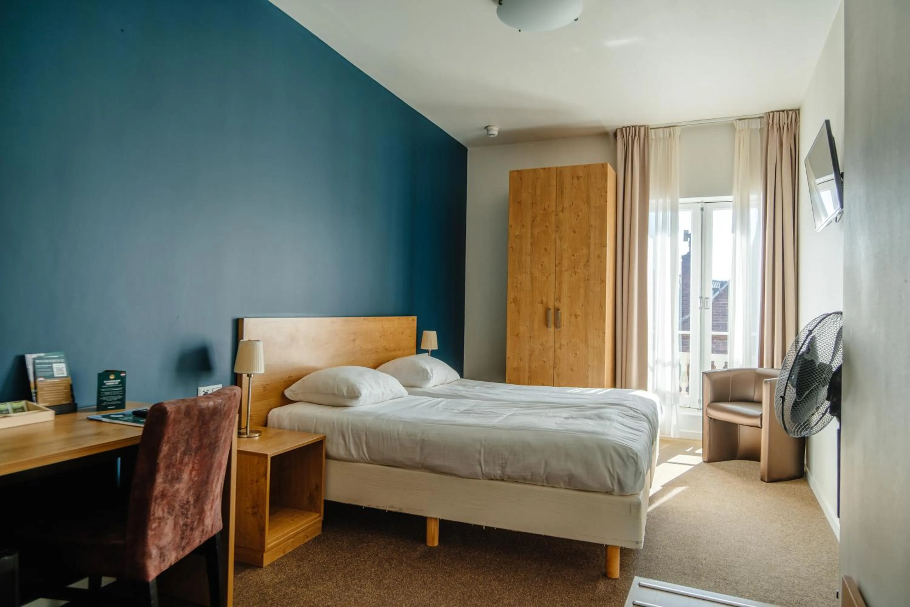 Bed in Ambassador City Centre Hotel