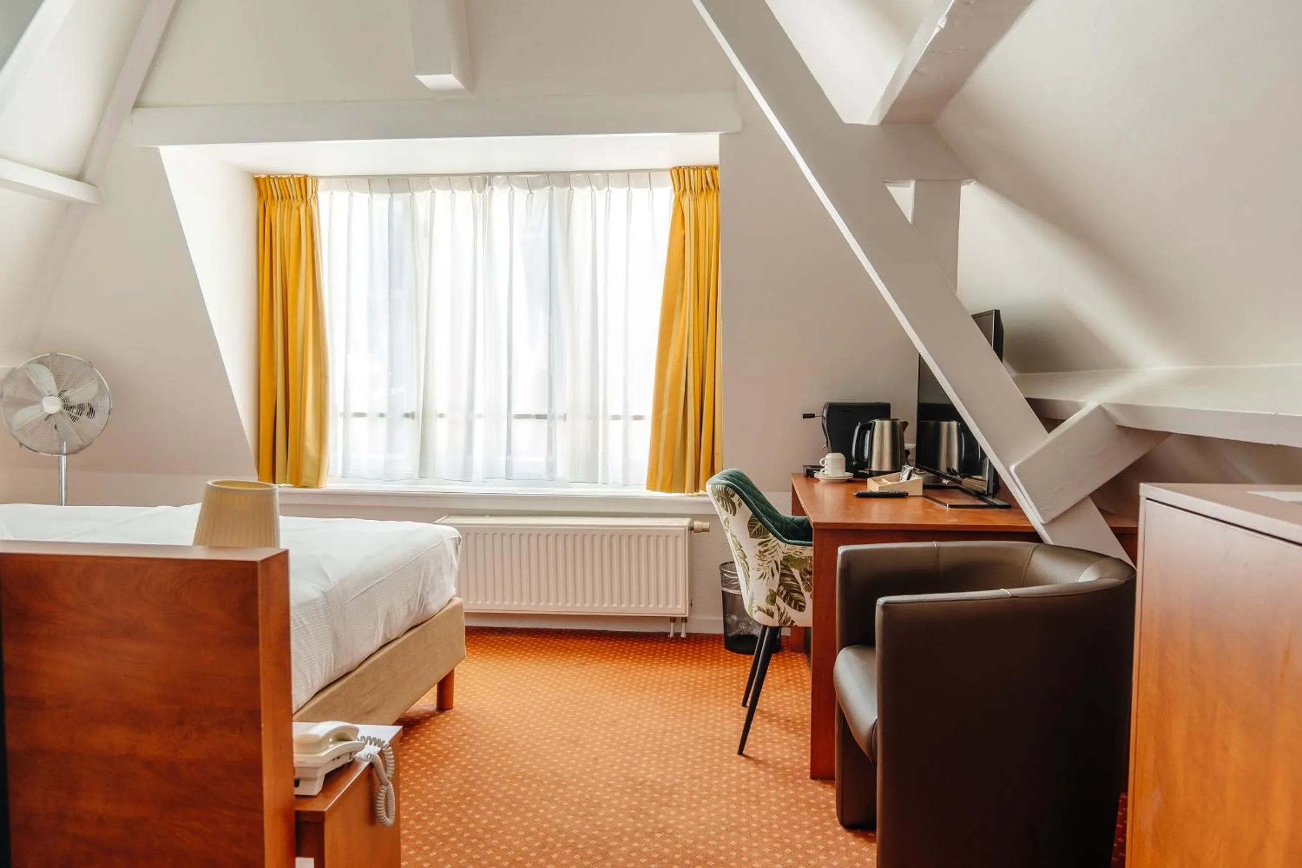 Bed in Ambassador City Centre Hotel