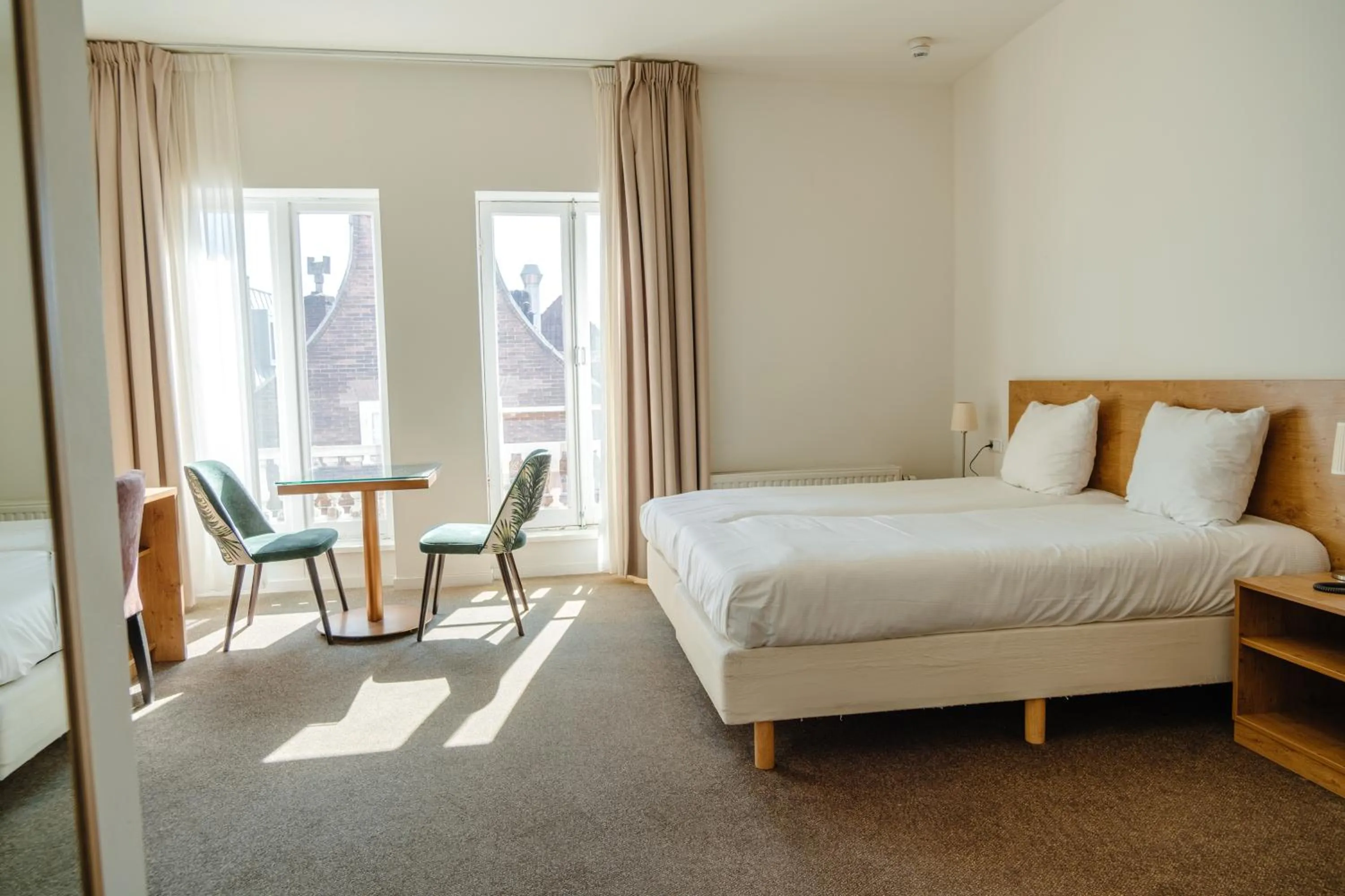 Bed in Ambassador City Centre Hotel