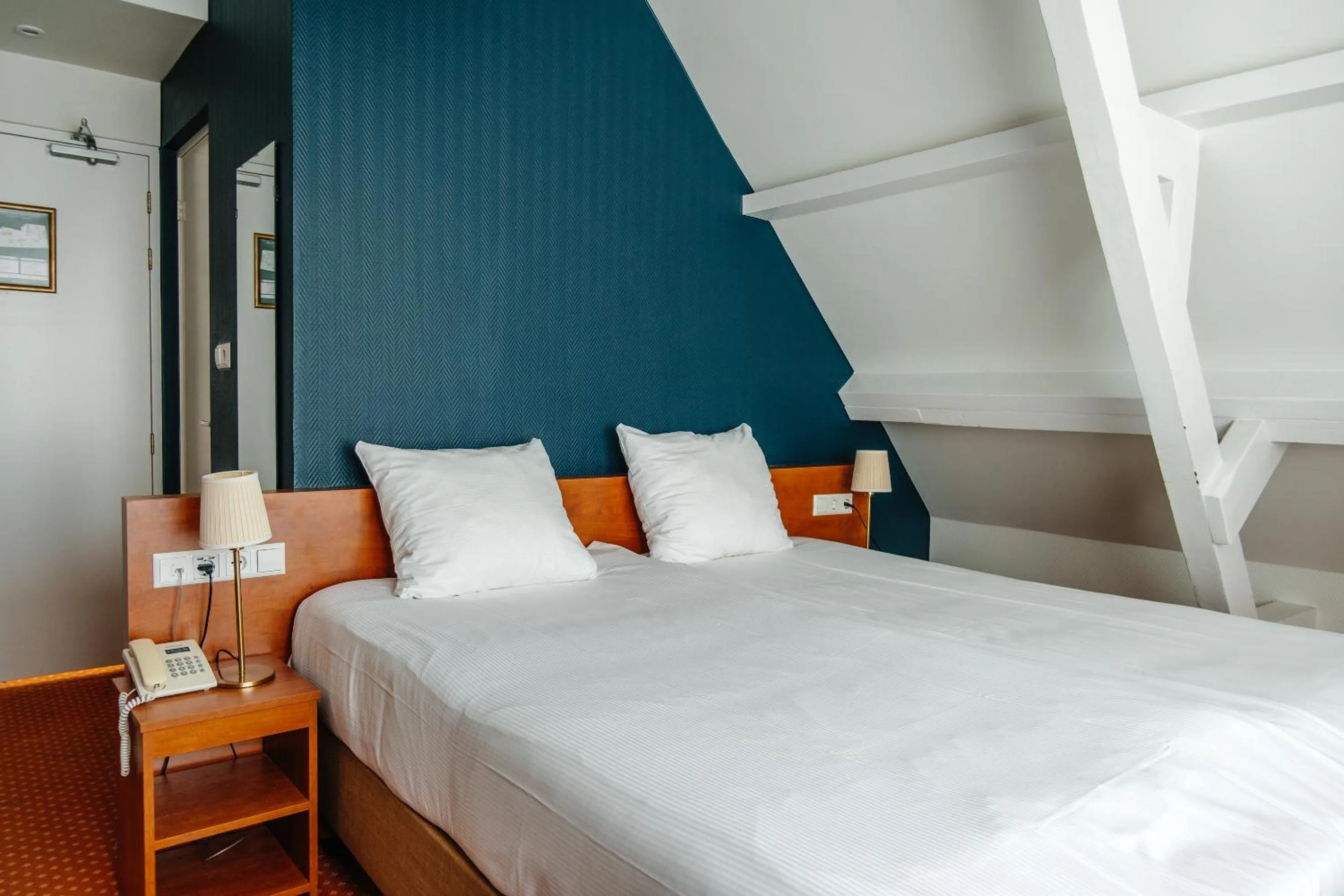 Bed in Ambassador City Centre Hotel