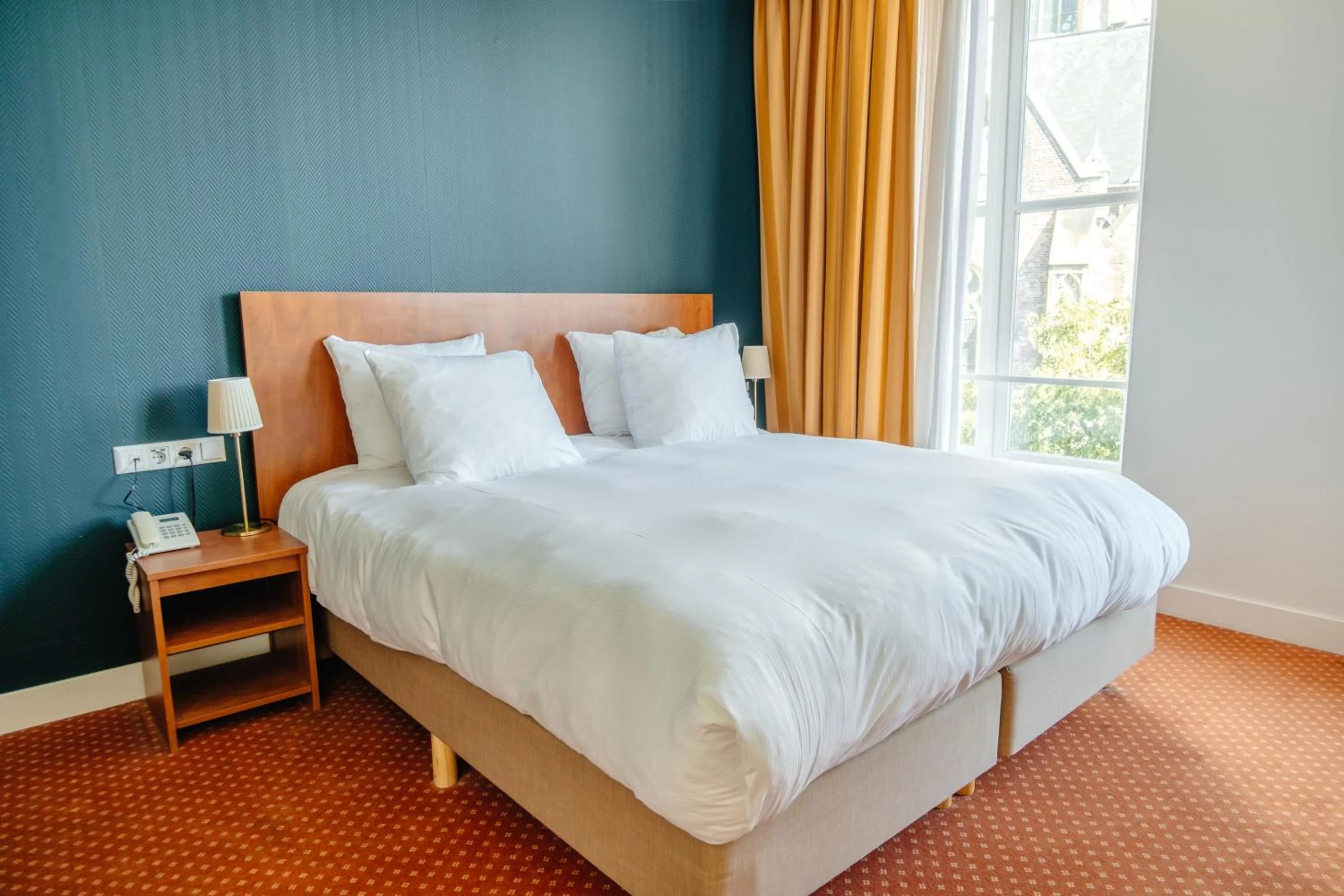 Bed in Ambassador City Centre Hotel