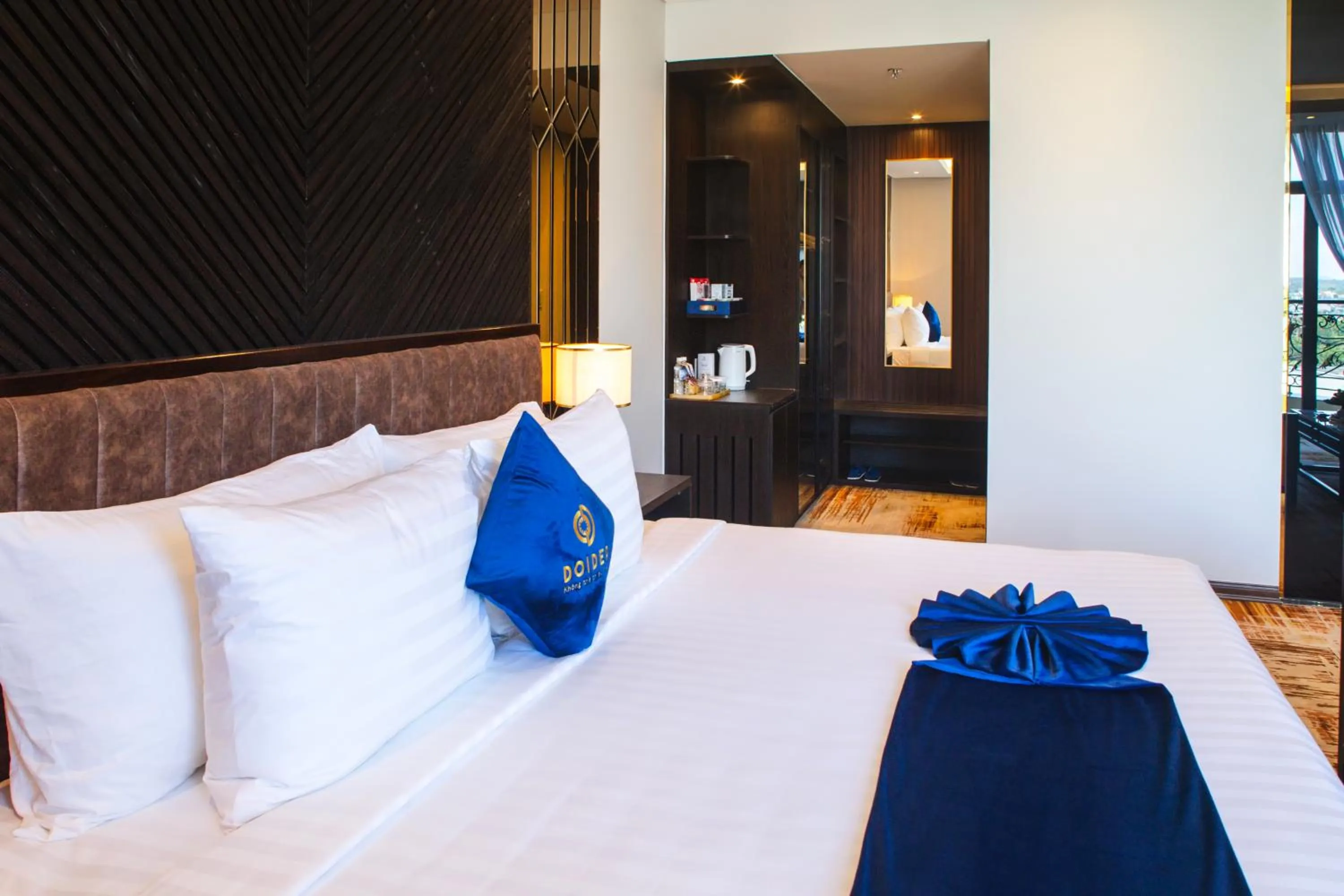 Bed in SANDALS AQUILA HOTEL