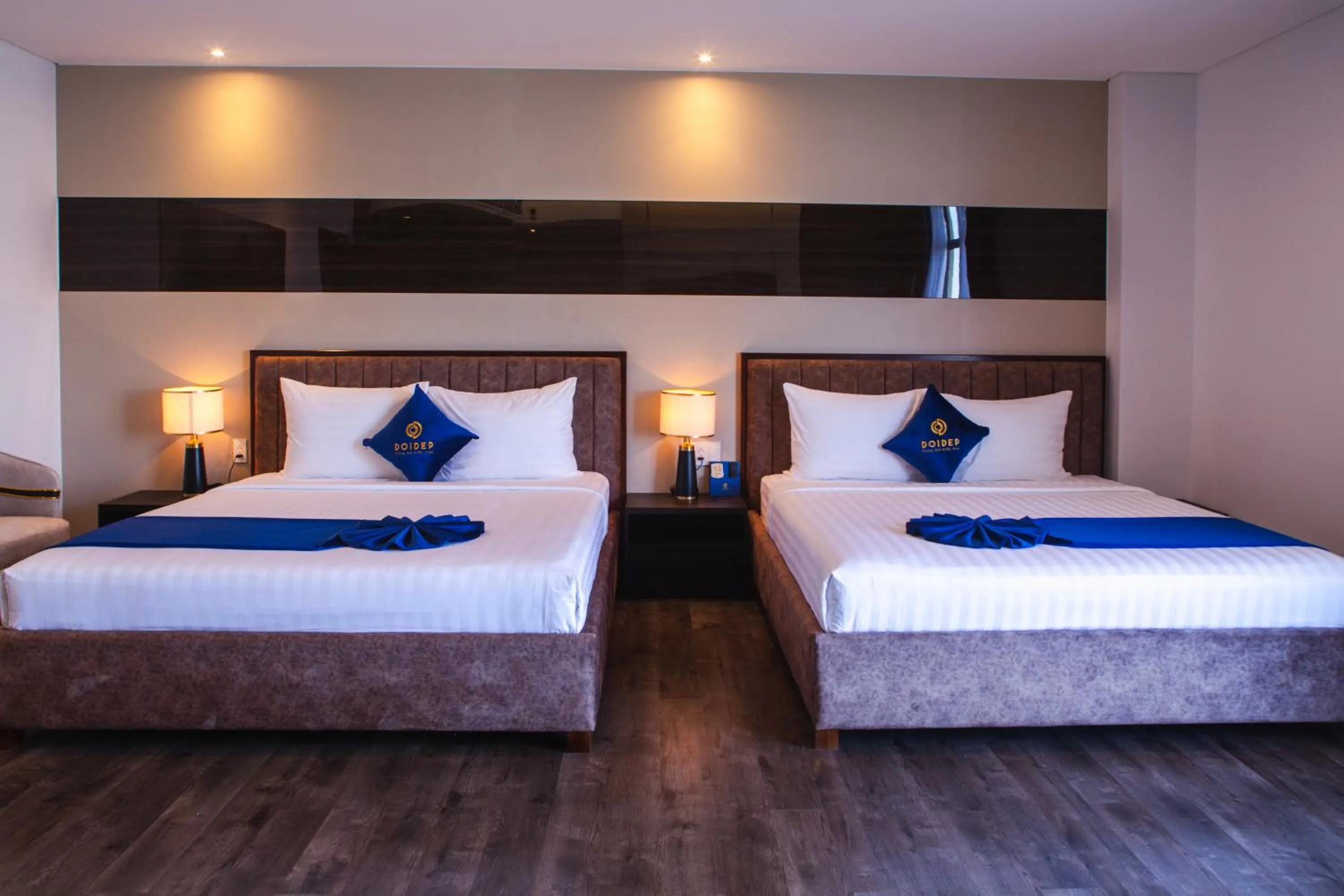 Bed in SANDALS AQUILA HOTEL