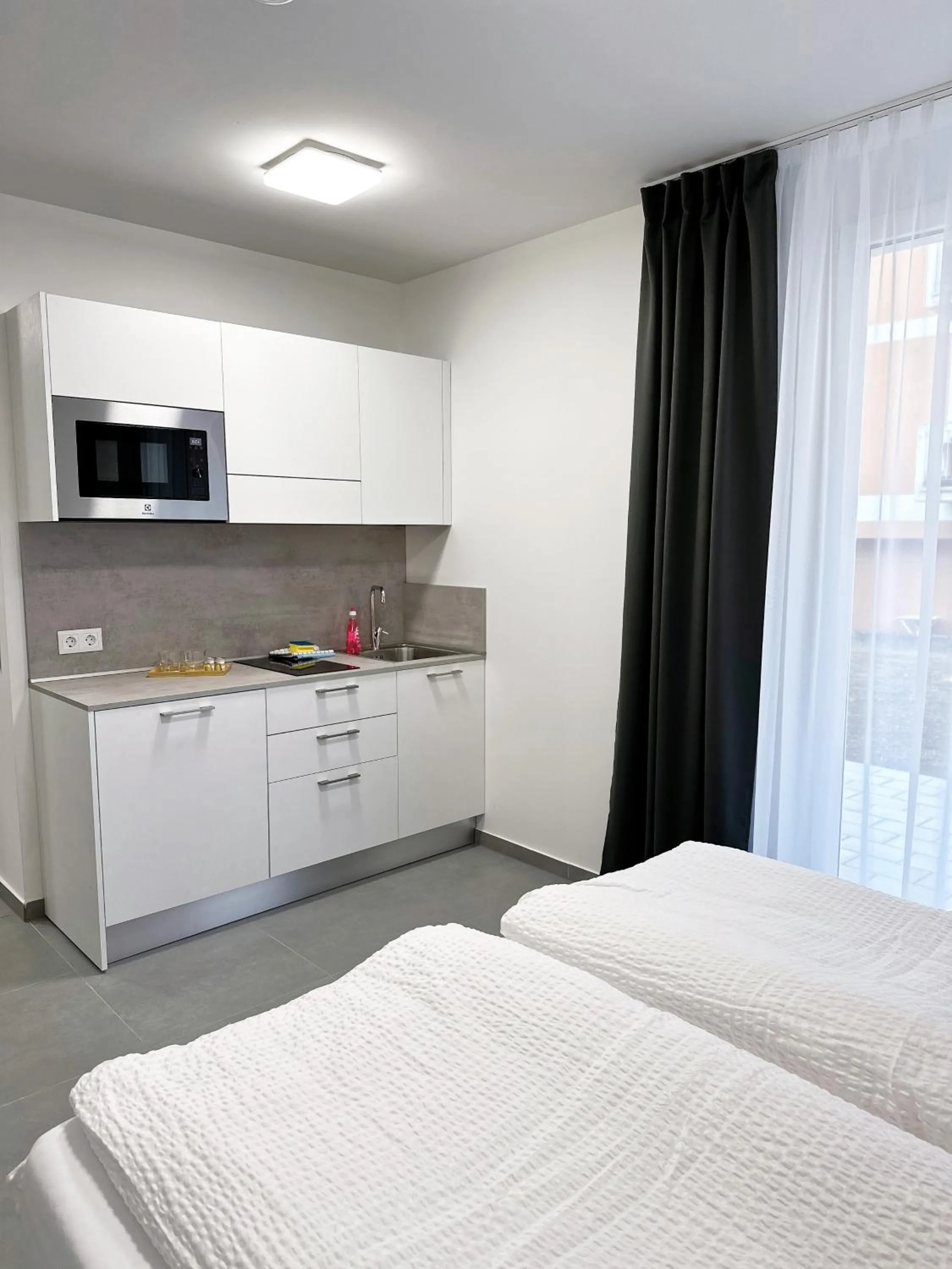 Kitchen or kitchenette, Bed in Grazora Living Apartments
