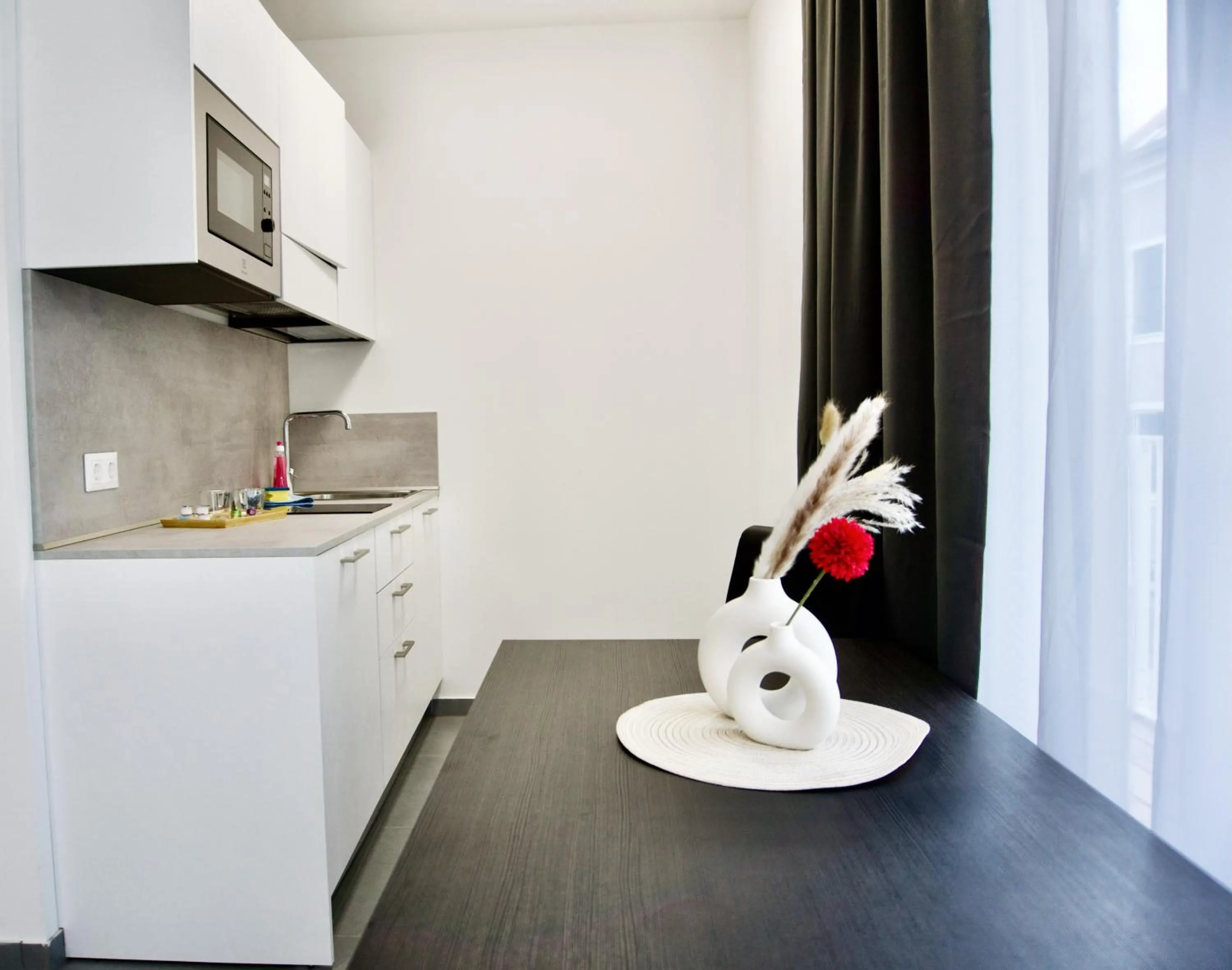 Kitchen or kitchenette in Grazora Living Apartments