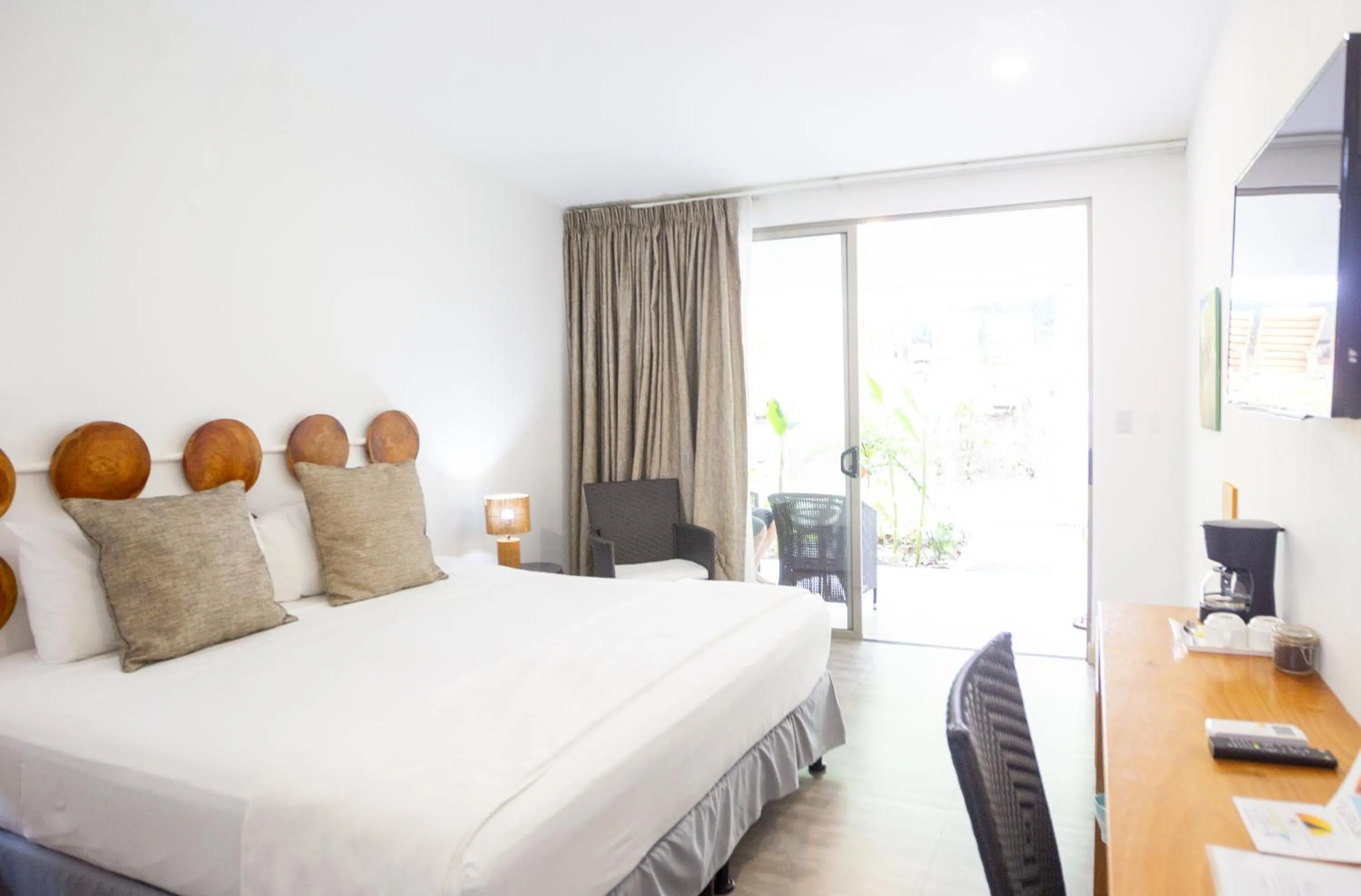 Bed in La Vela Boutique Hotel