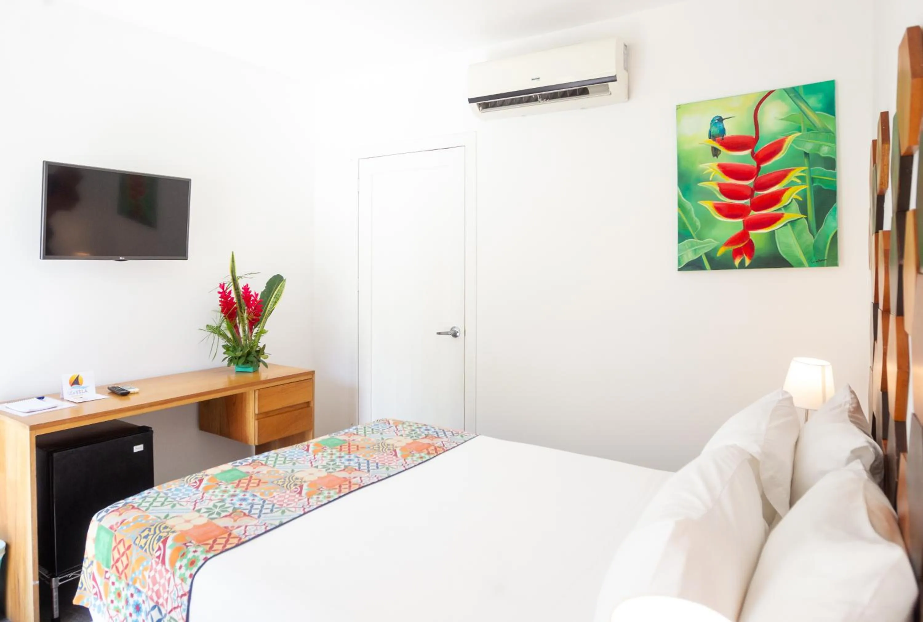 Bed in La Vela Boutique Hotel