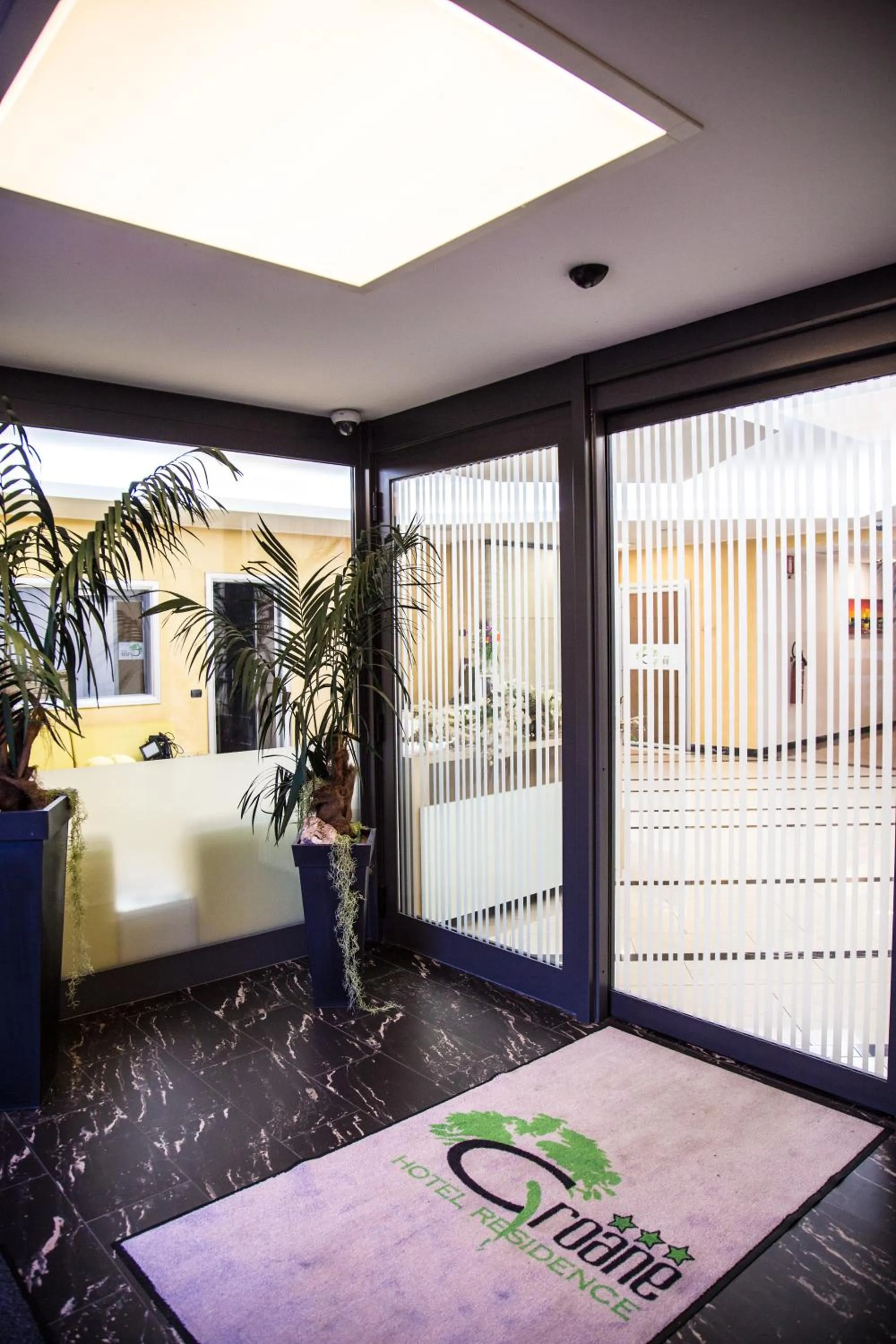 Property logo or sign in Groane Hotel Residence