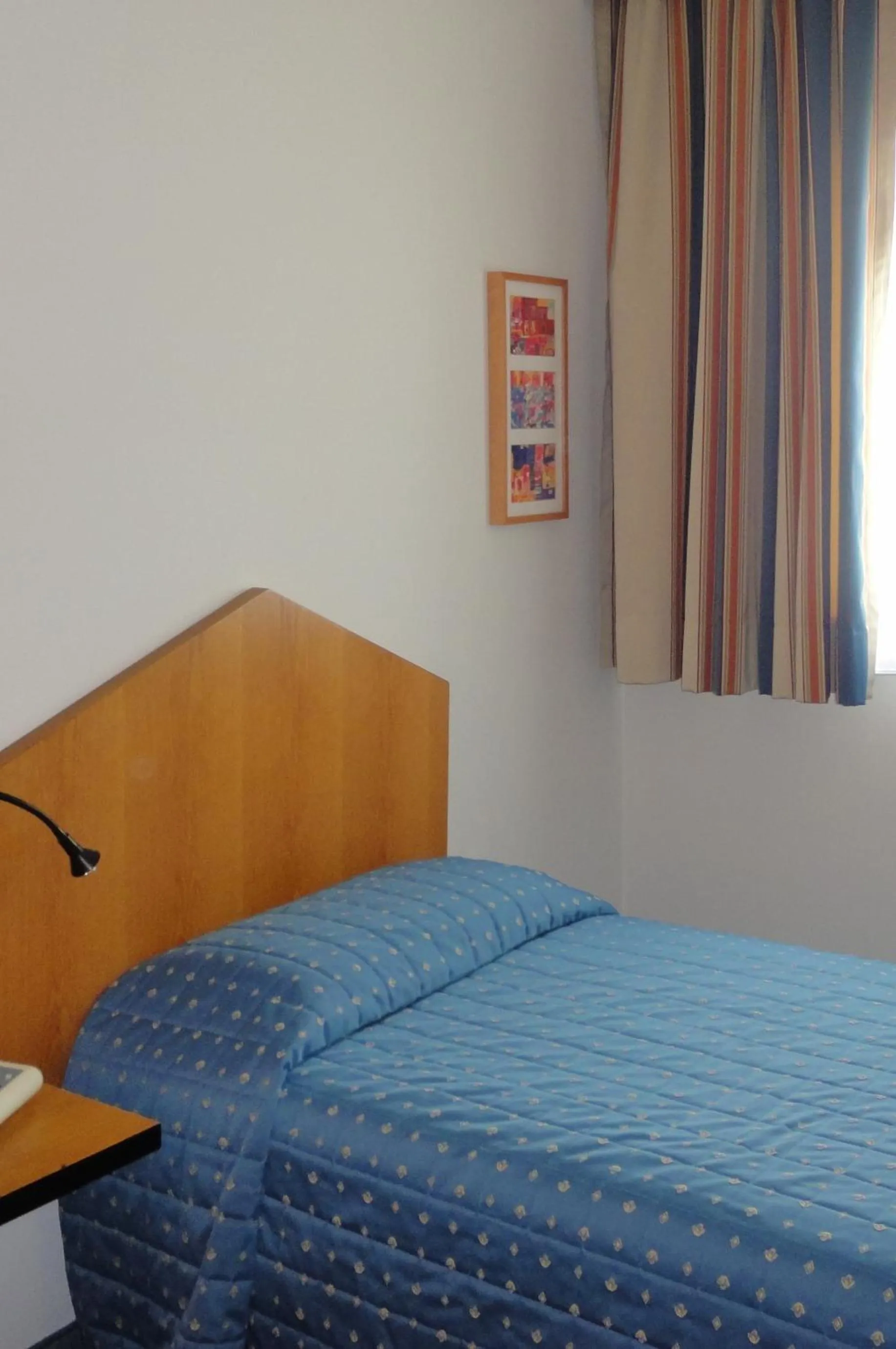 Bed in Cravero Rooms