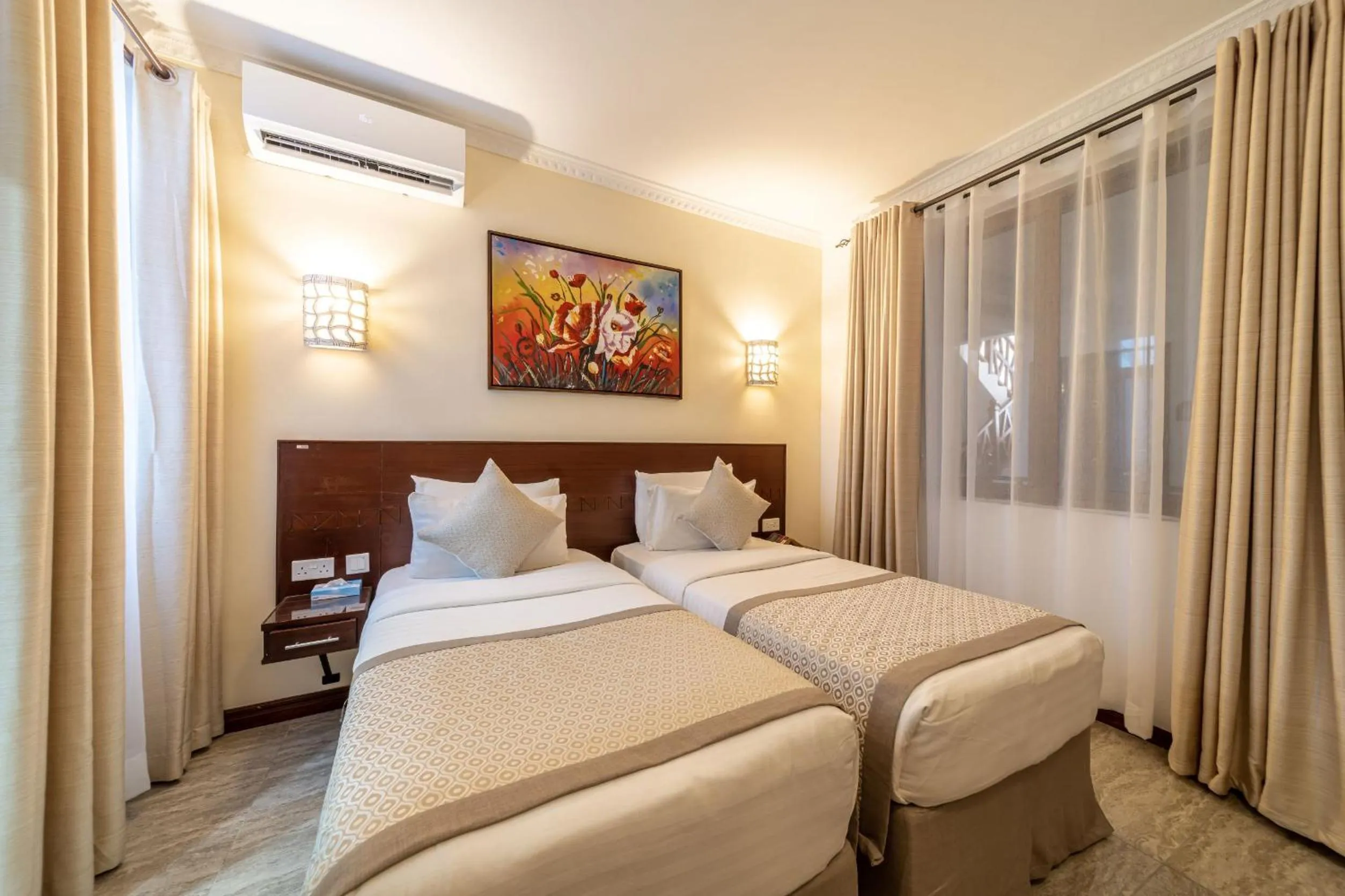 Bed in PrideInn Hotel Diani