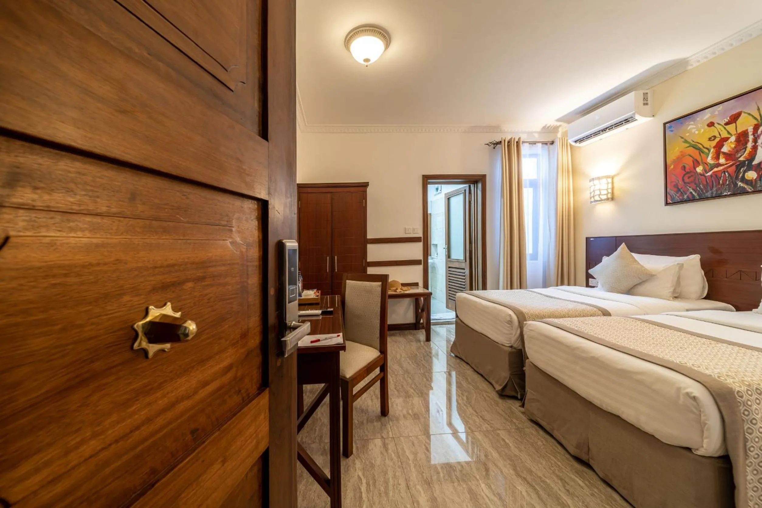 Bed in PrideInn Hotel Diani