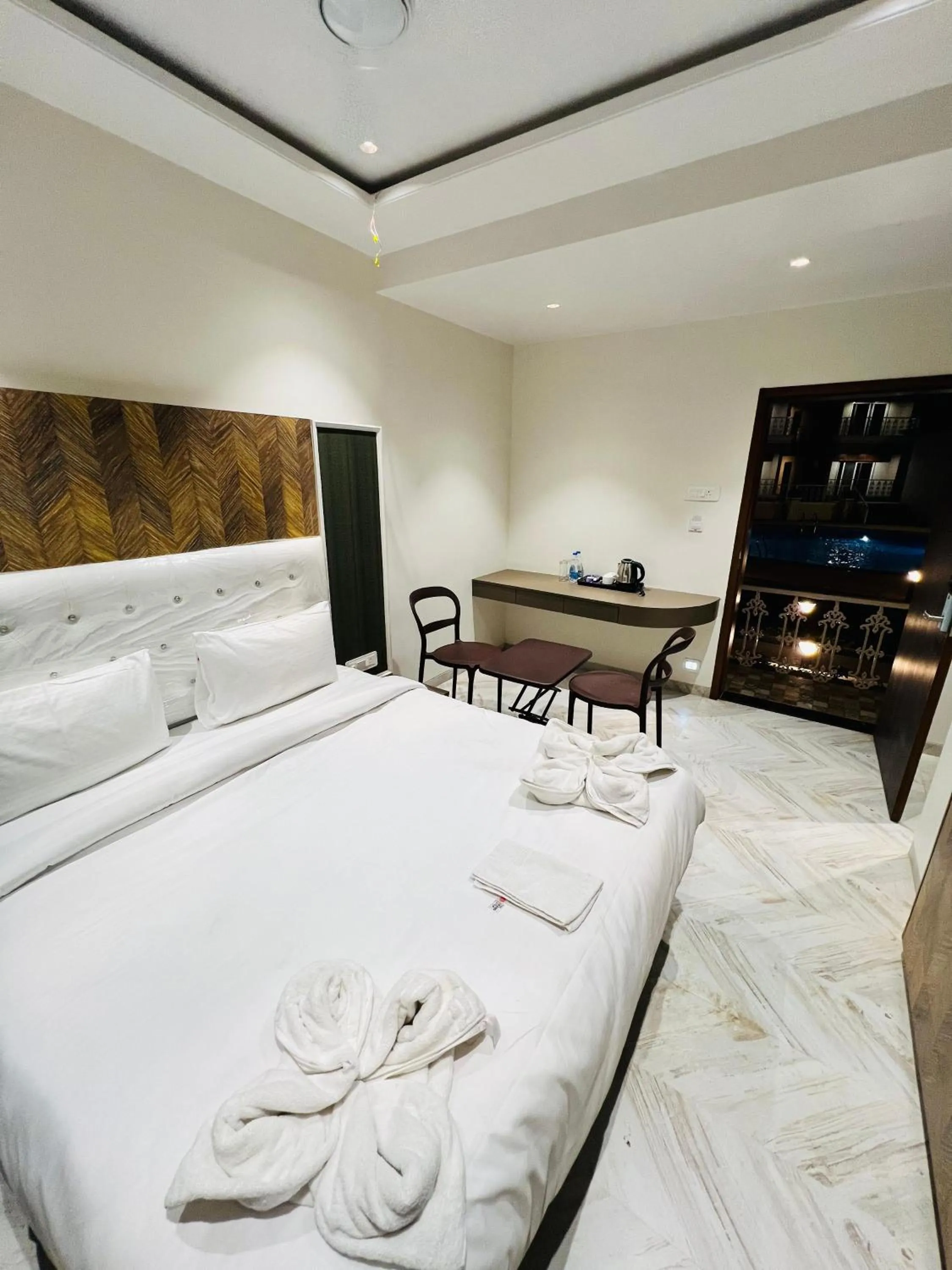 View (from property/room), Bed in The Grand Leela Resort