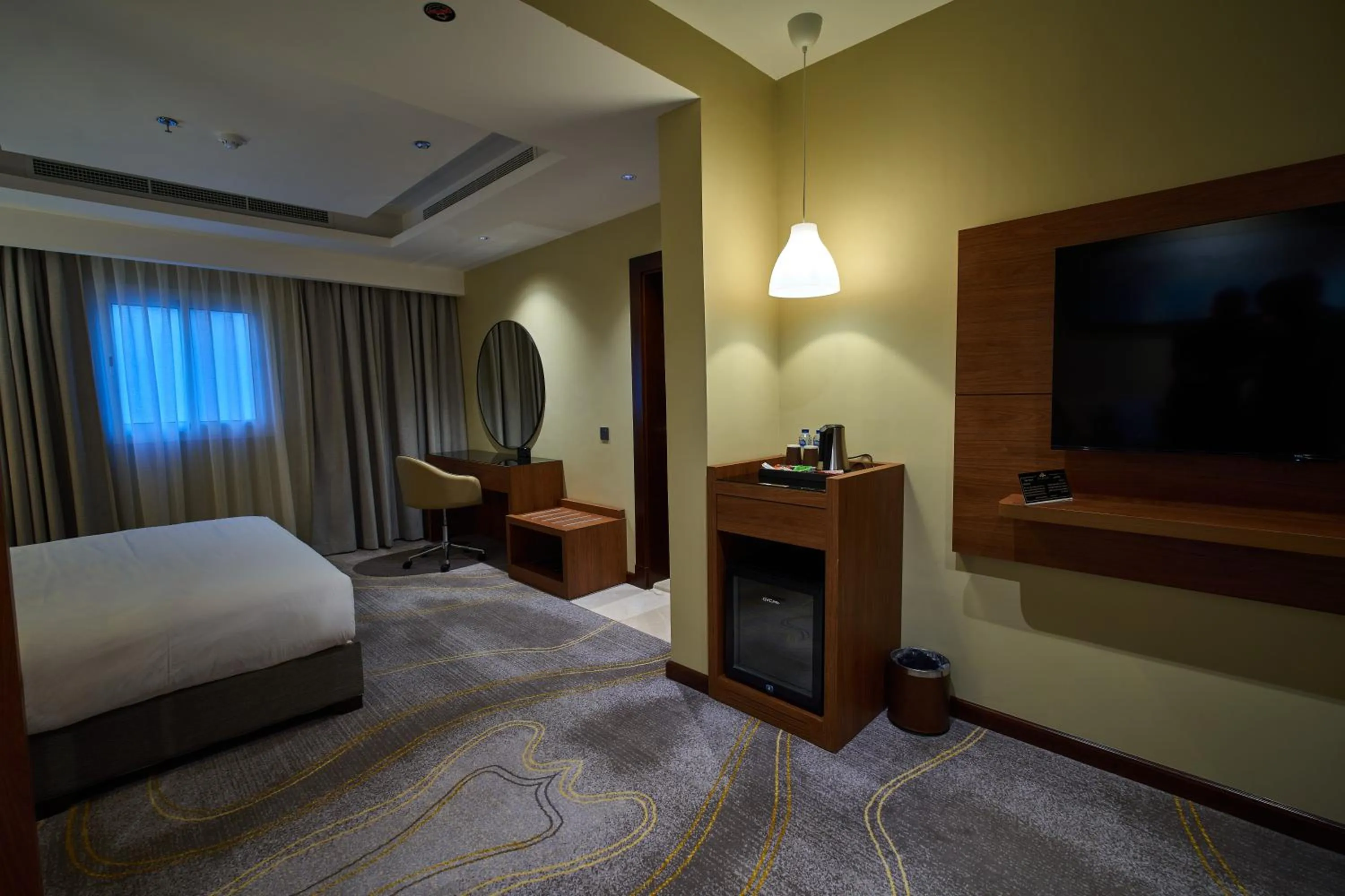 Communal lounge/ TV room, Bed in Platinum Hotel