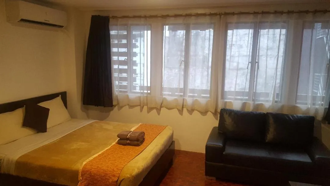 Bed in Gervasia Hotel Makati