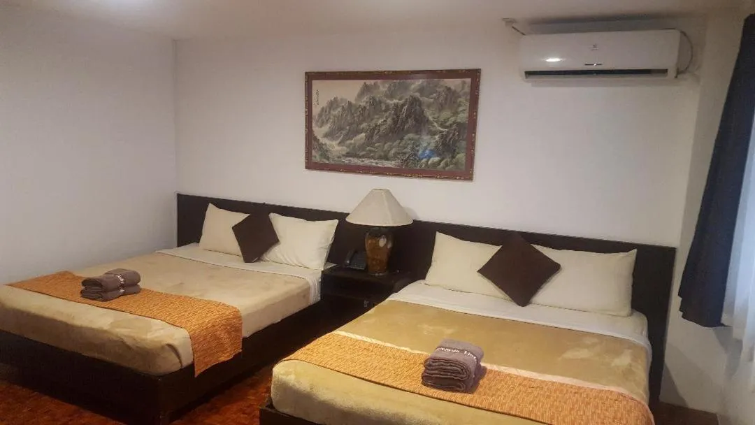 Bed in Gervasia Hotel Makati