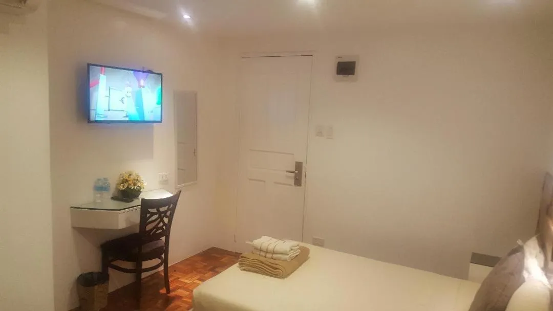 Bed in Gervasia Hotel Makati