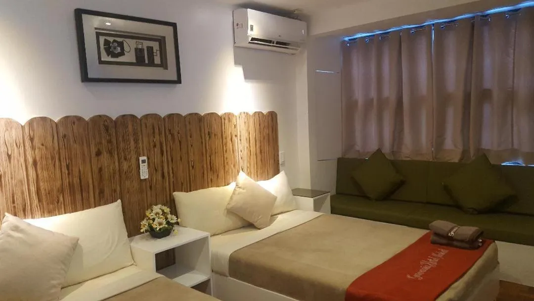 Bed in Gervasia Hotel Makati