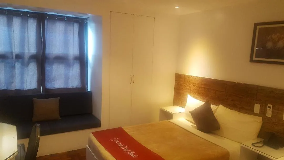 Bed in Gervasia Hotel Makati