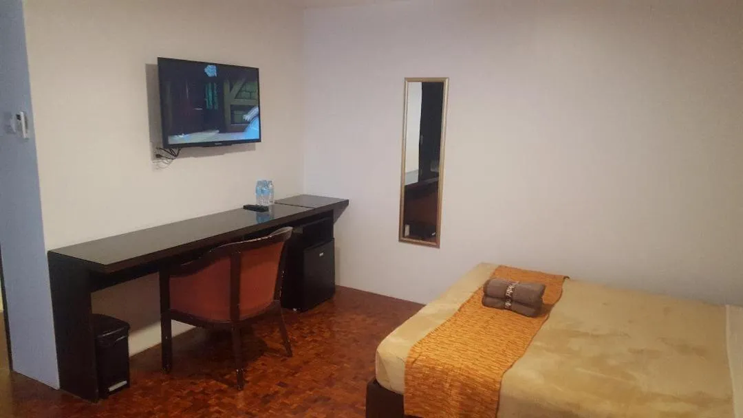 Bed in Gervasia Hotel Makati