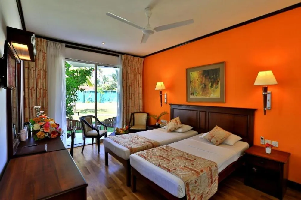 Bed in Hibiscus Beach Hotel & Villas
