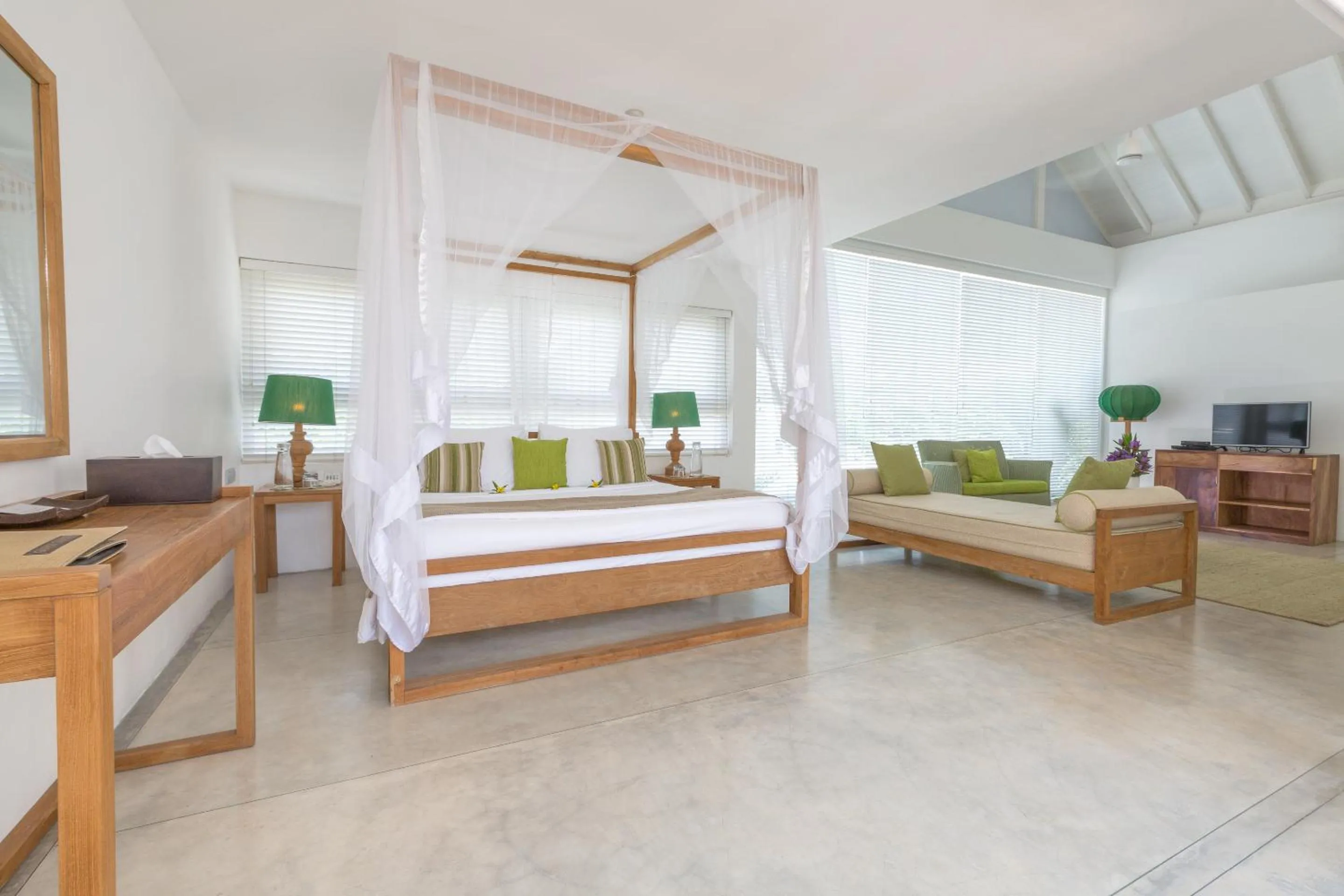 Bed in Sri Sharavi Beach Villas & Spa - with 43 metre saltwater infinity pool