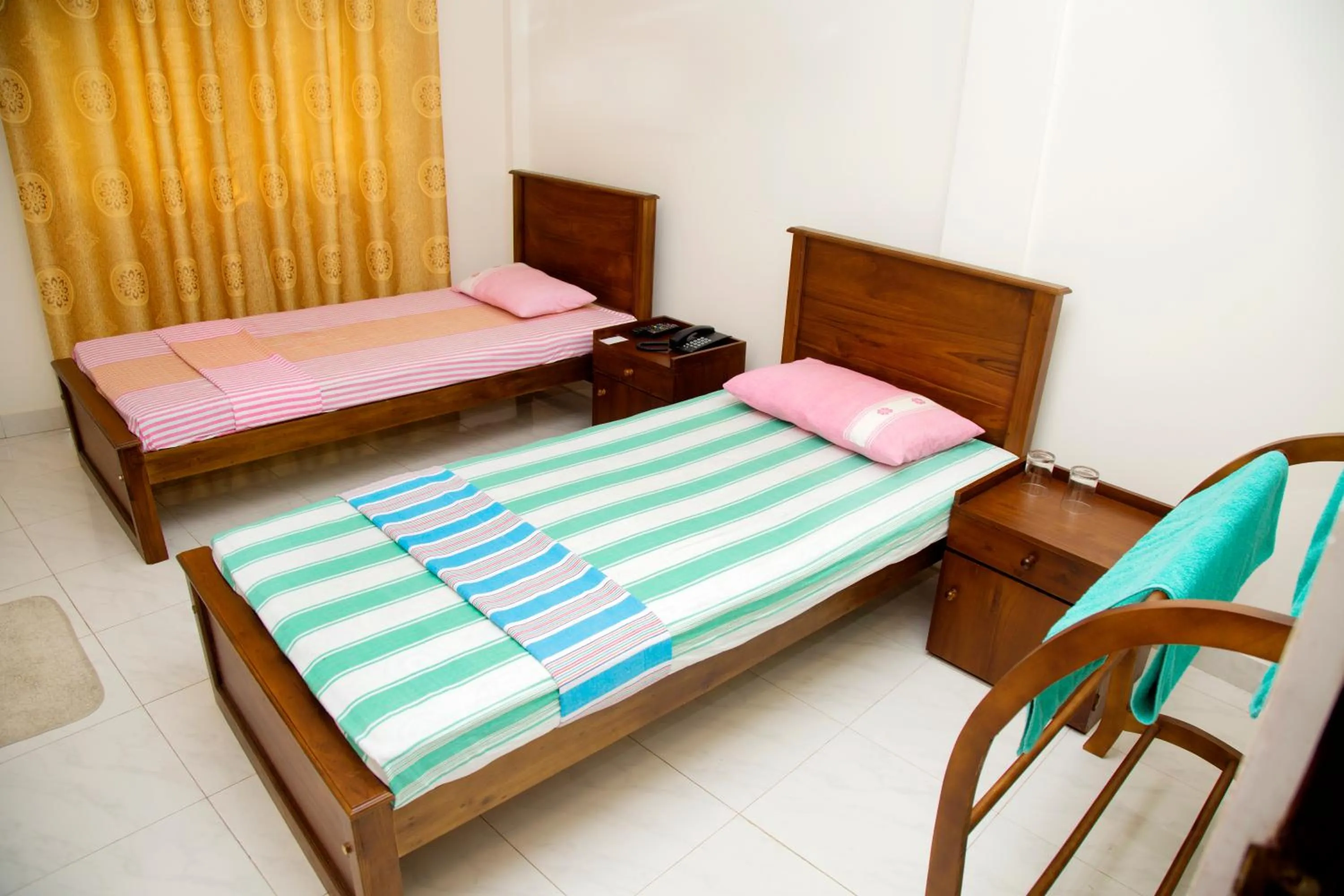 Bed in Auslink Hotel