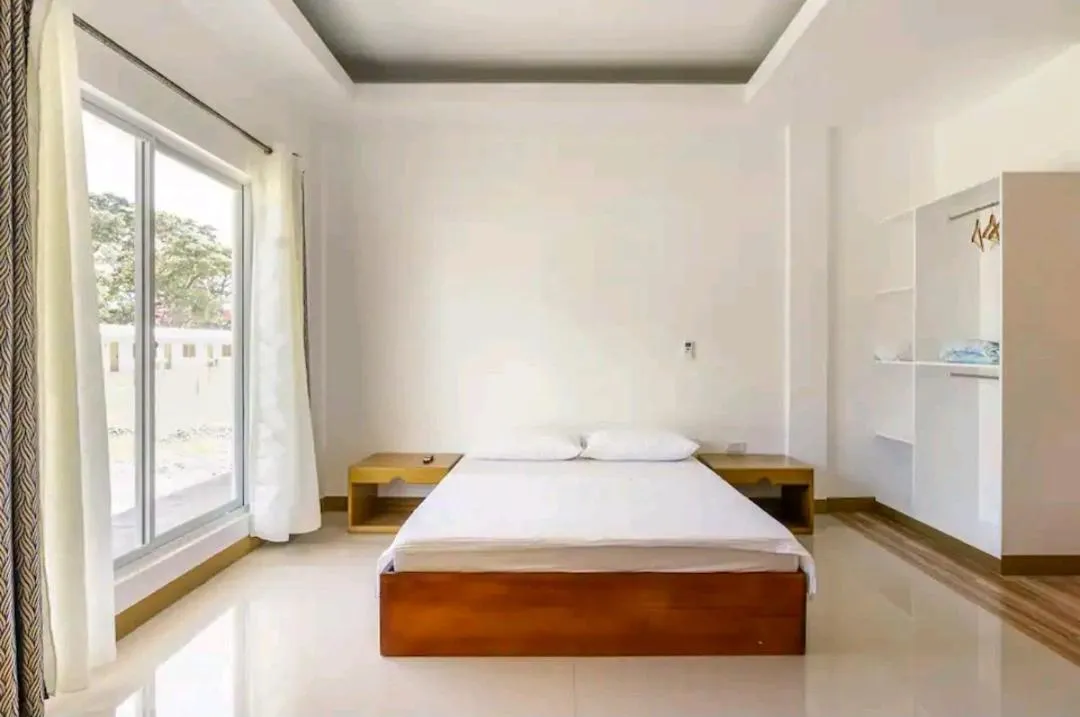 Bed in E and C tourist inn