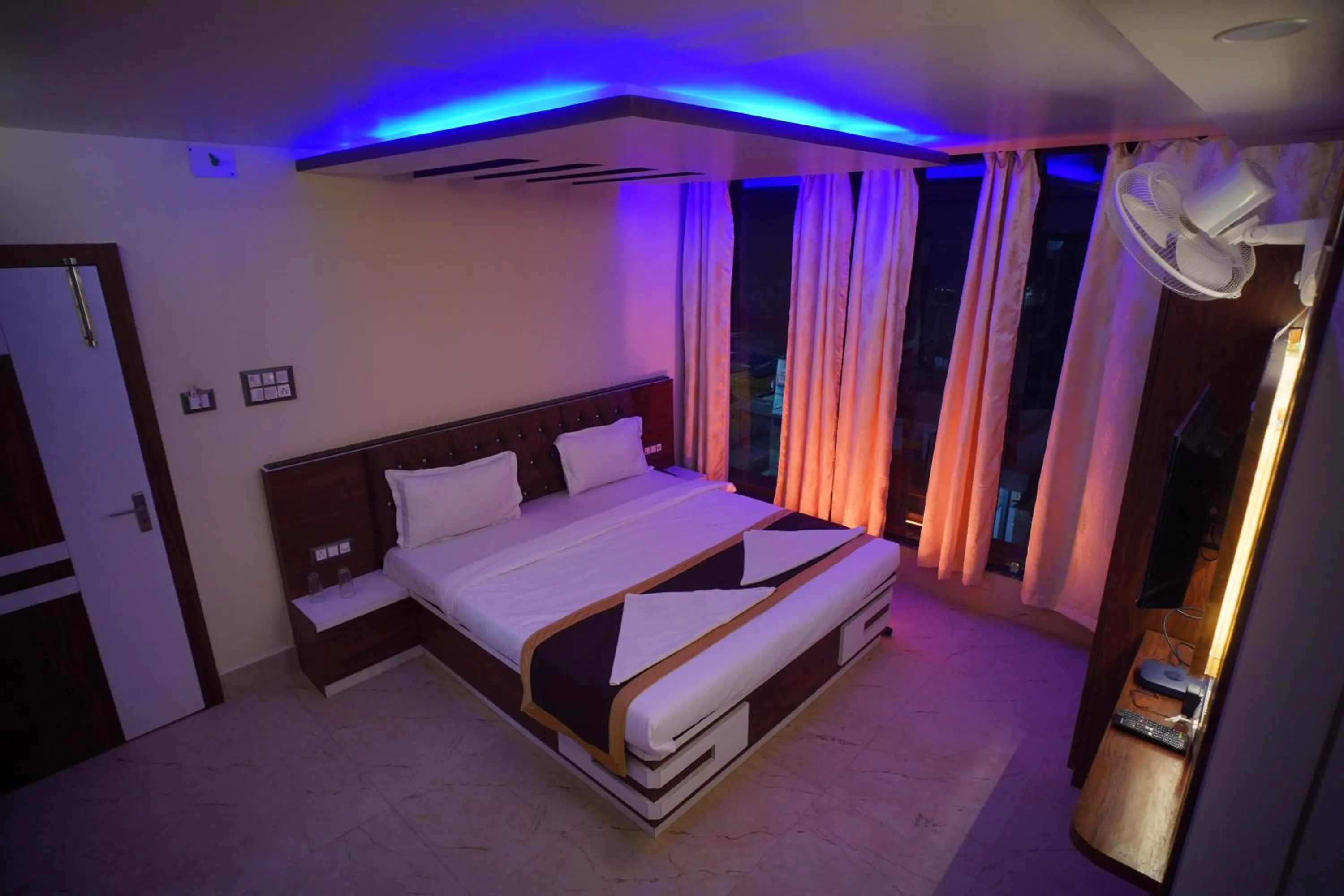 Bed in Hotel Asha Inn