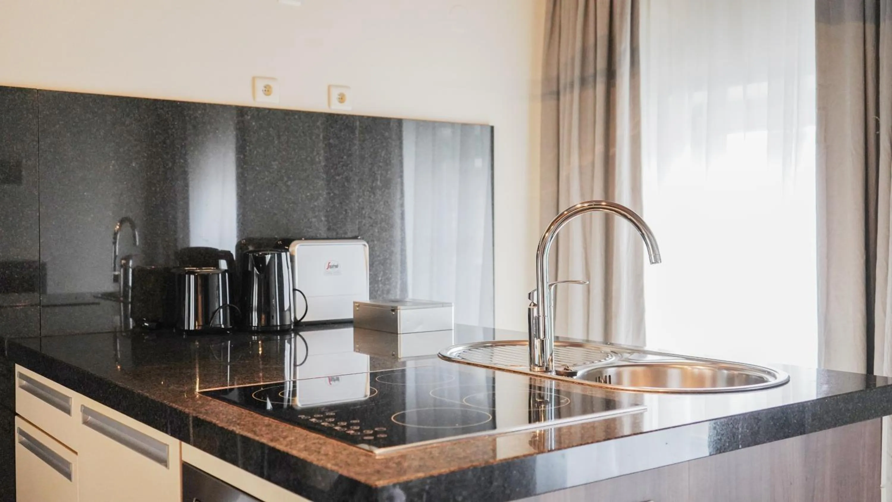 Kitchen or kitchenette in Amosa Liège City Centre Hotel