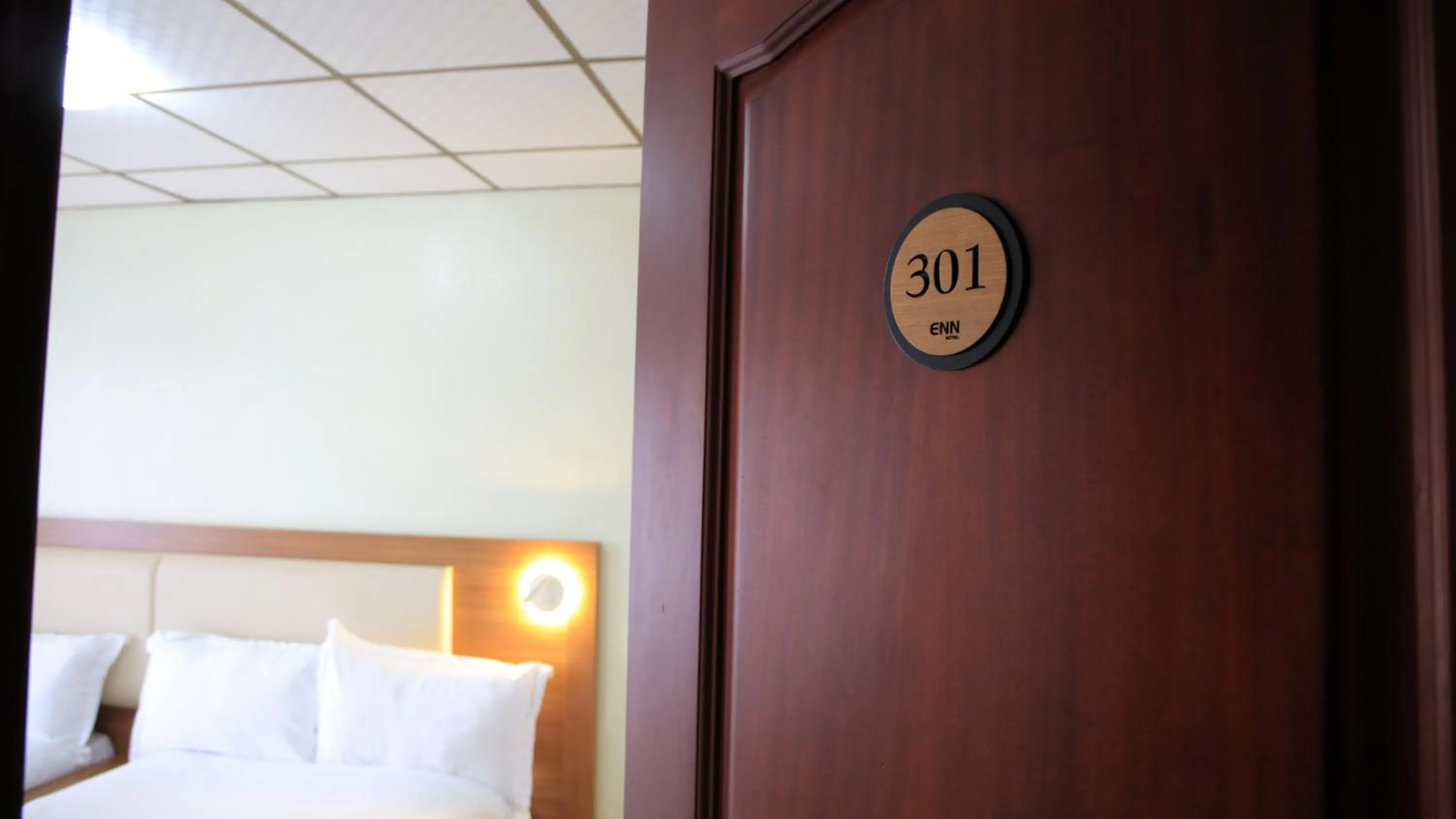 Bedroom, Bed in ENN Business Hotel