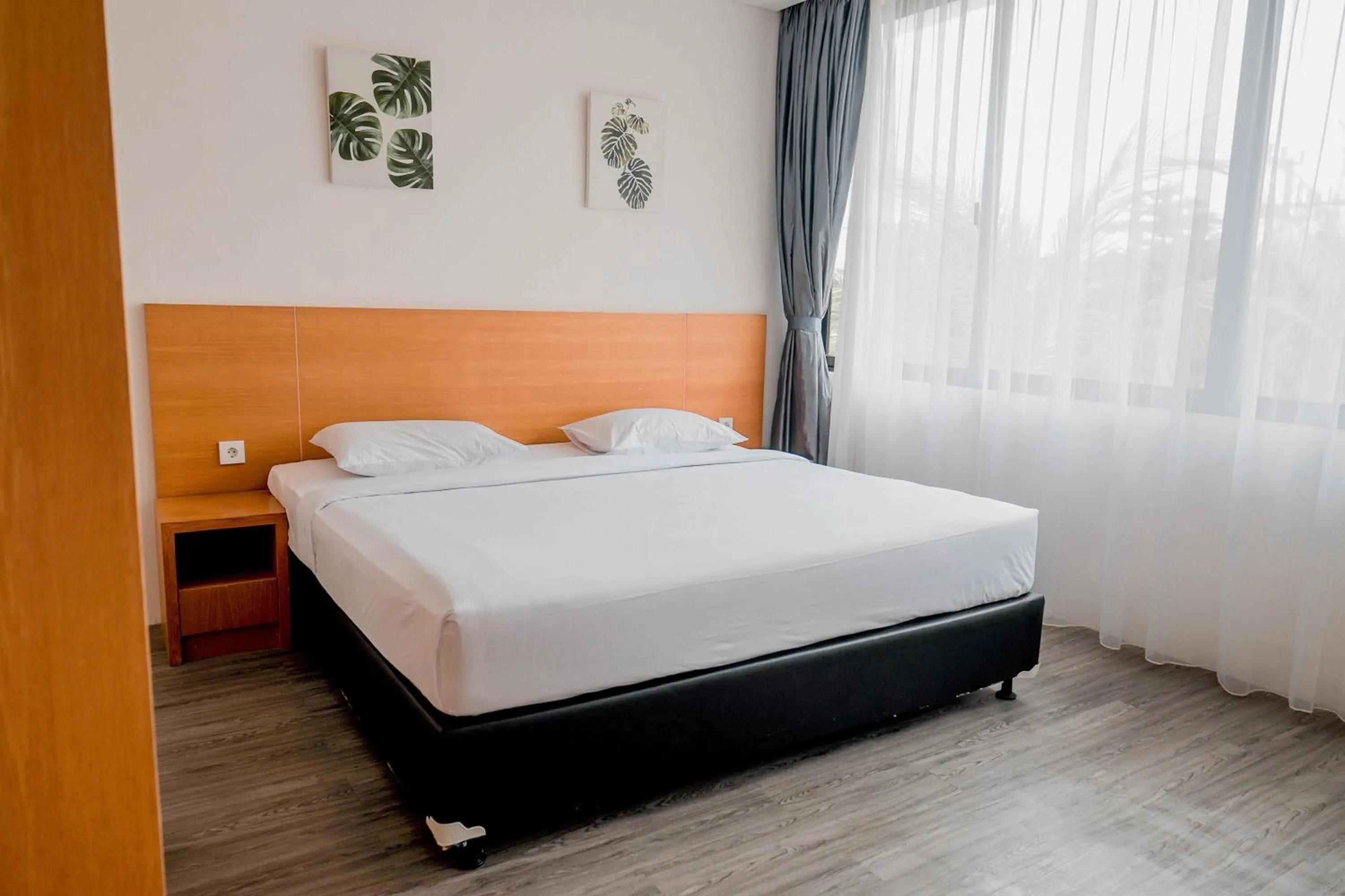 Photo of the whole room, Bed in Sunrise Suite Seminyak by ARM Hospitality