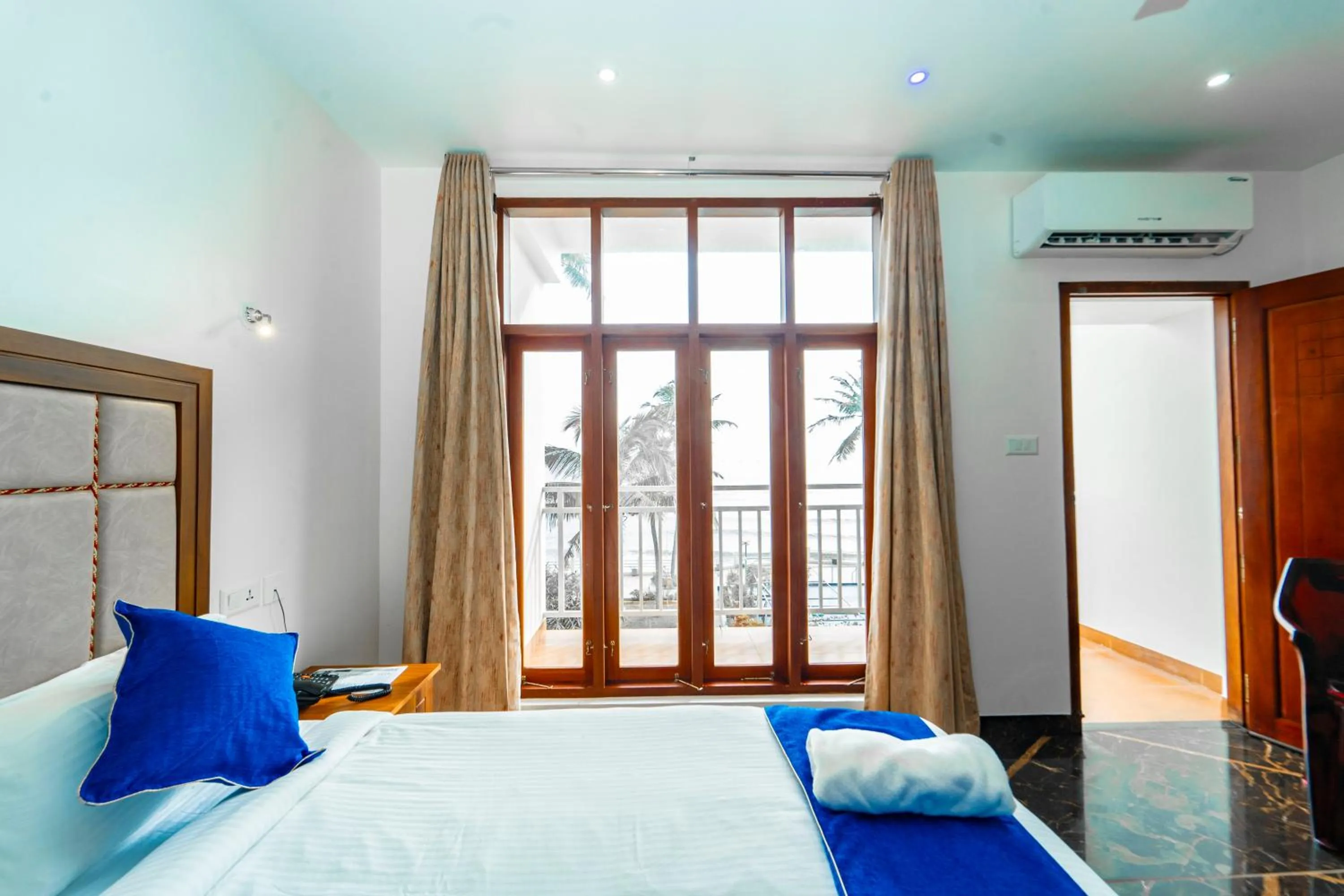 Bed in Skylar Seaview Beach Resort & Ayurveda Varkala