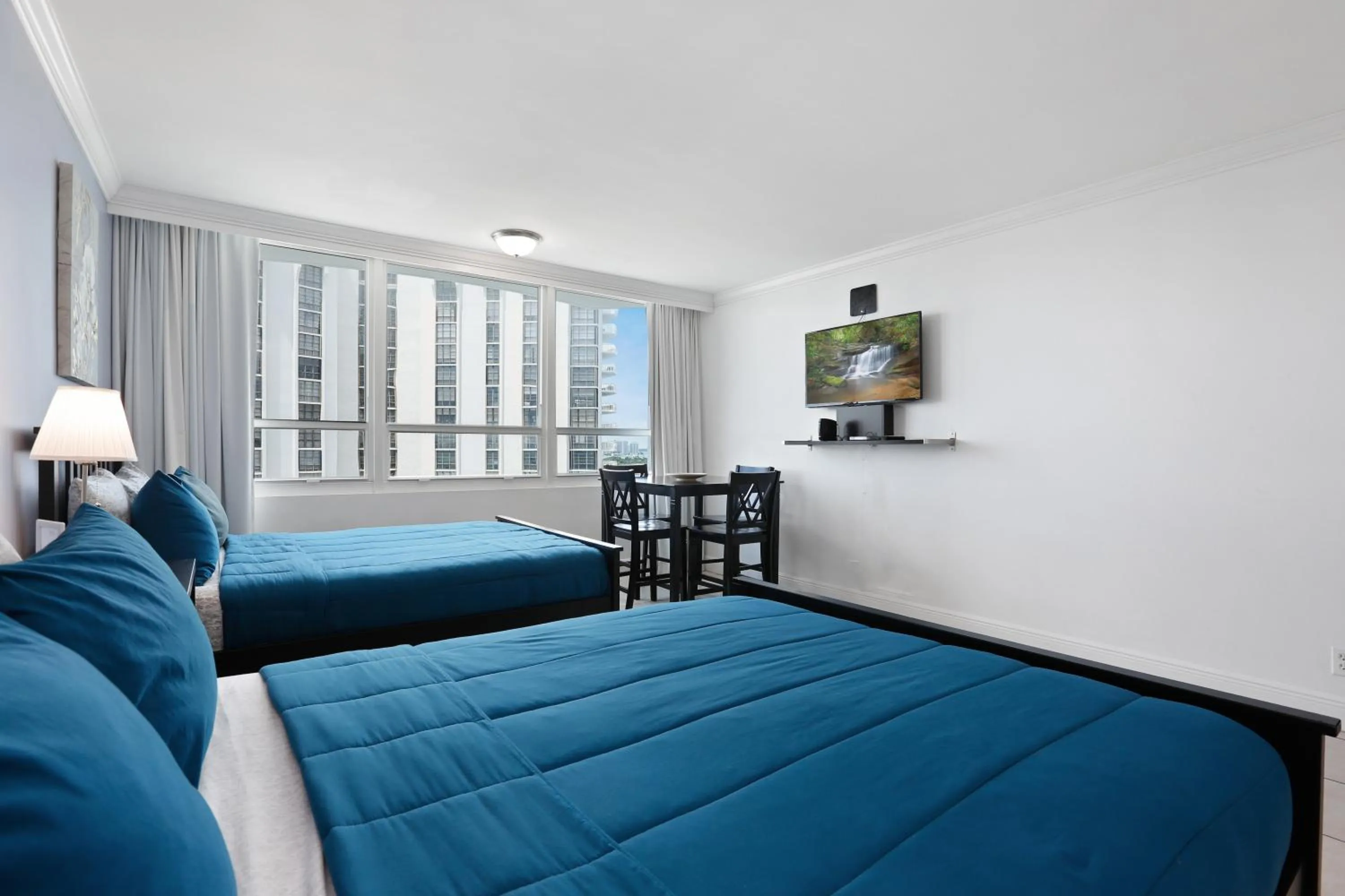 Bed in Miami Beach Apartments by MiaRentals