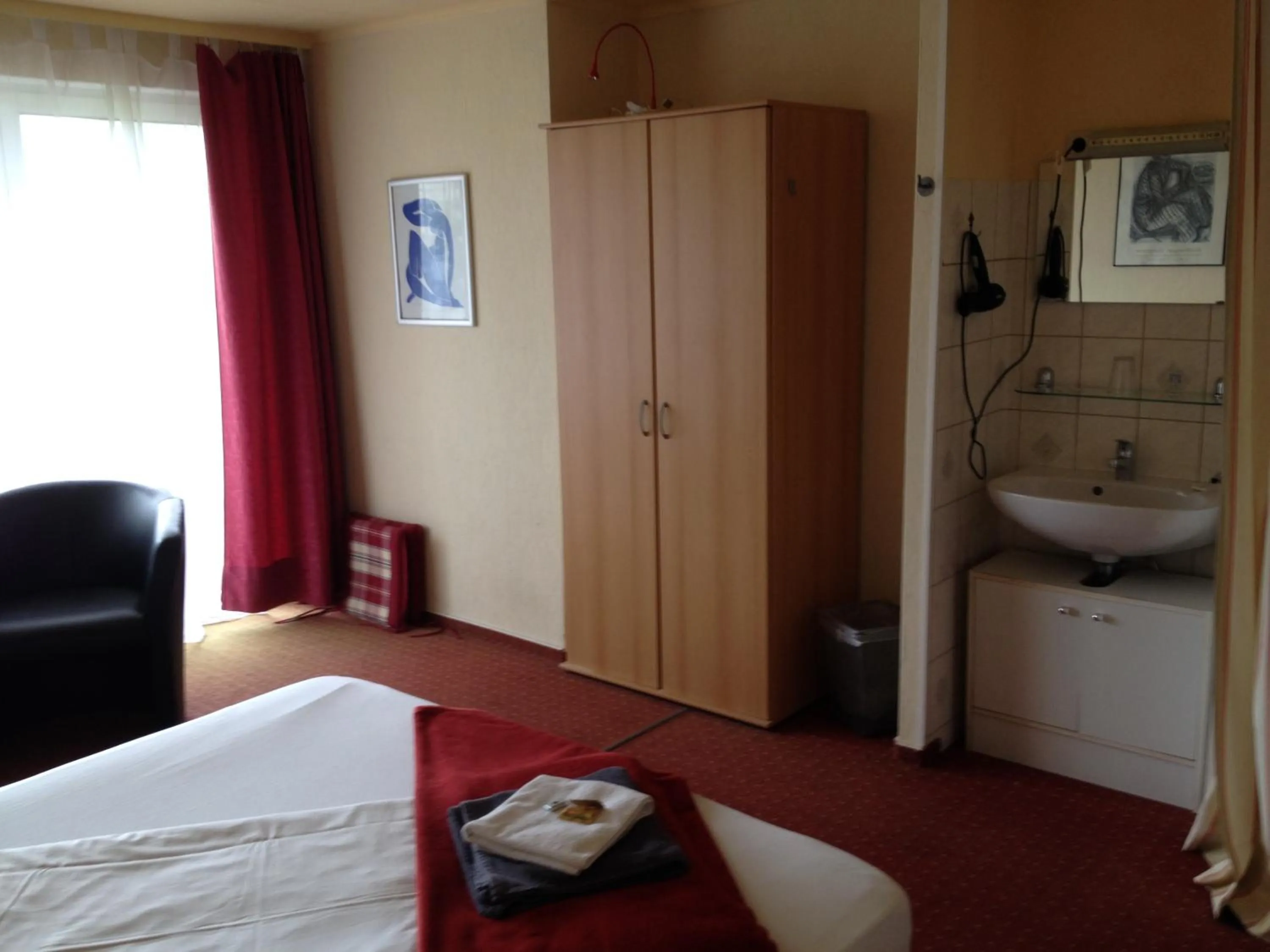 Photo of the whole room, Bed in Hotel Saarland Lebach