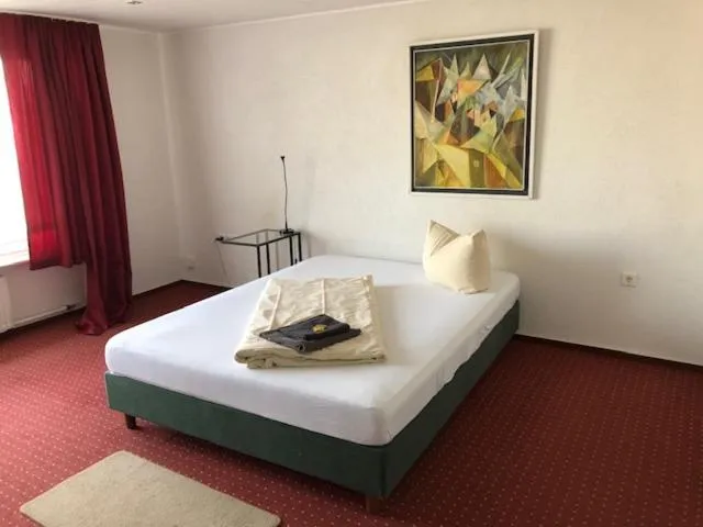 Photo of the whole room, Bed in Hotel Saarland Lebach