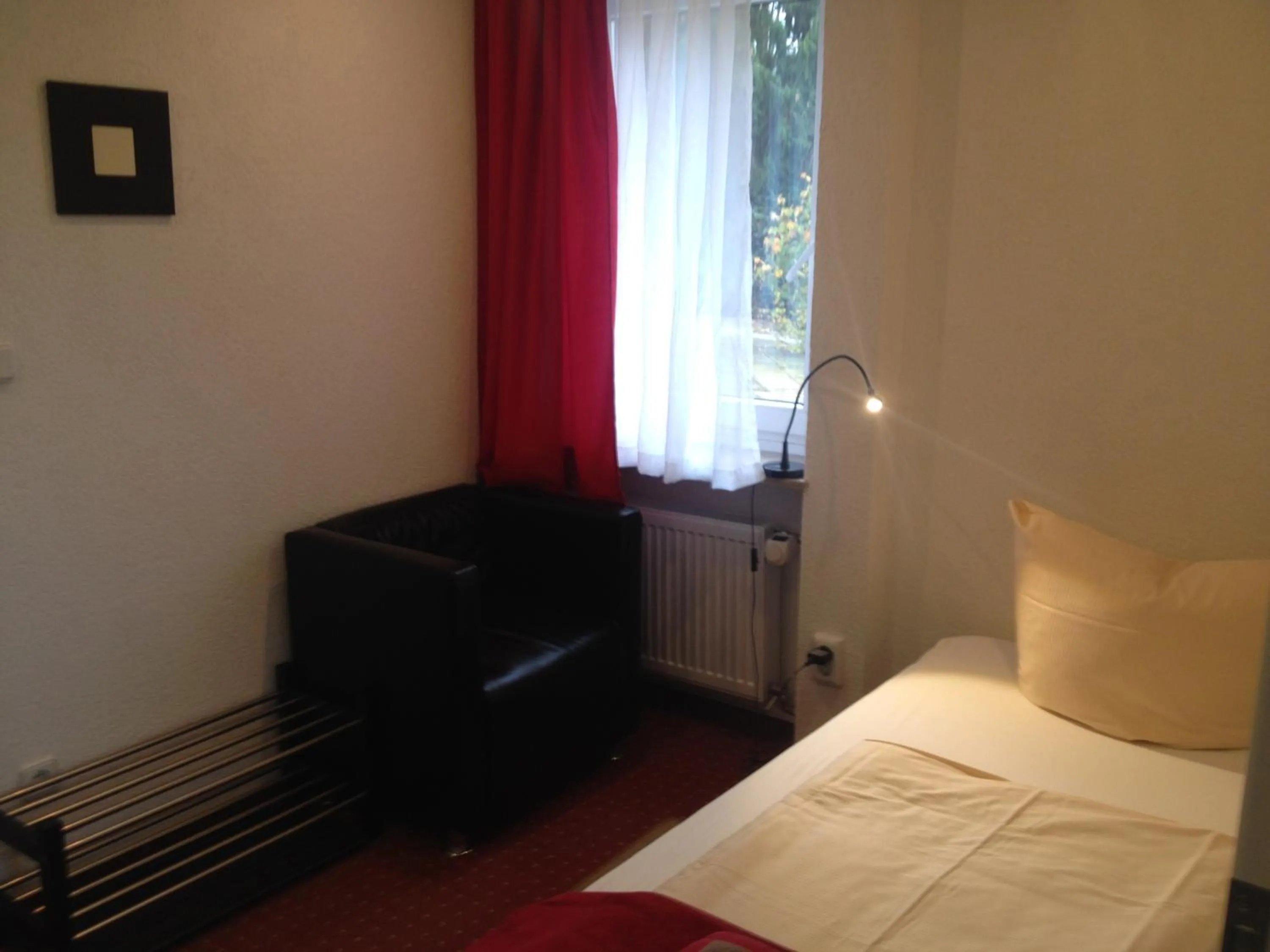 Photo of the whole room, Bed in Hotel Saarland Lebach