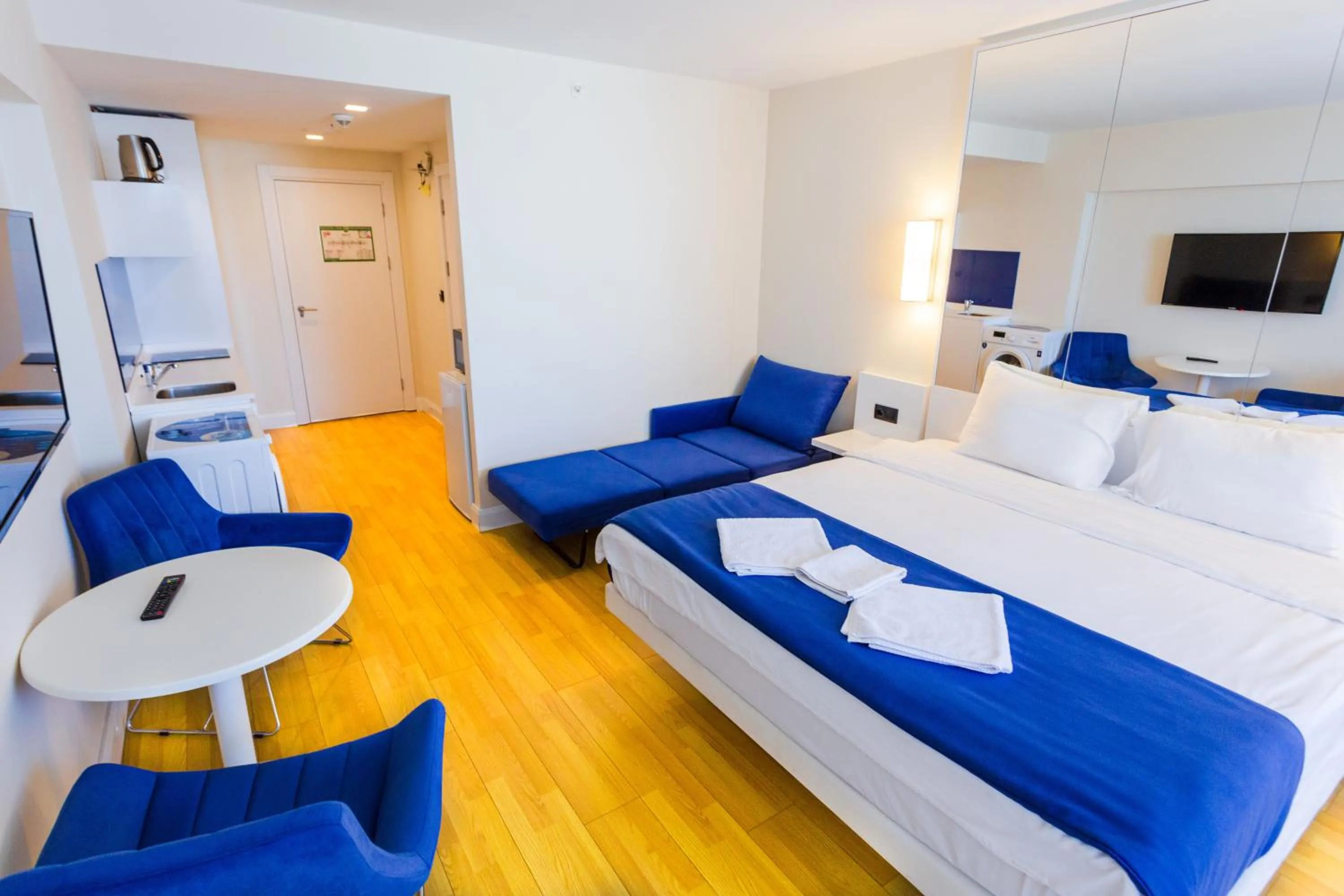 Seating area, Bed in Orbi City Hotel