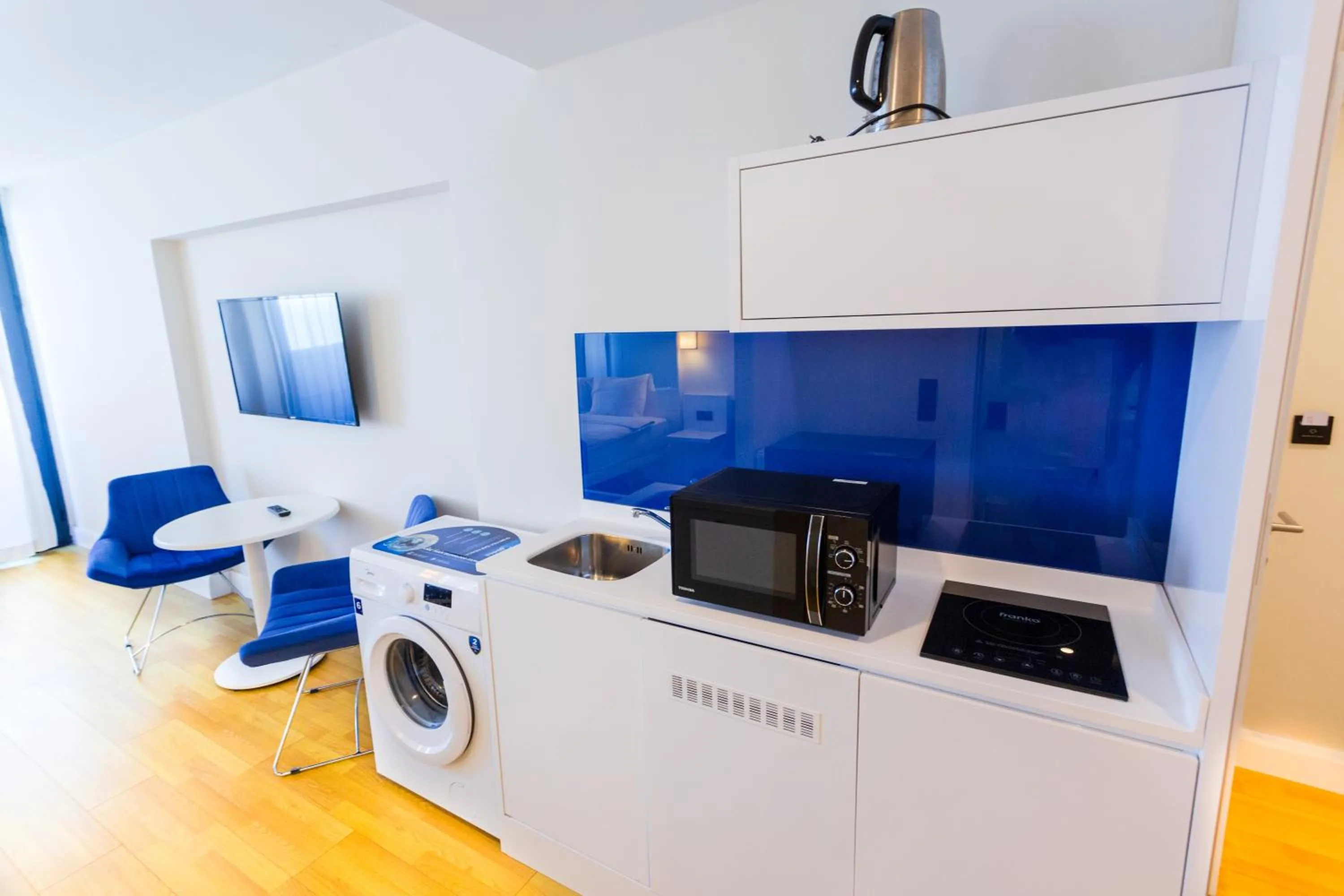 Kitchen or kitchenette in Orbi City Hotel