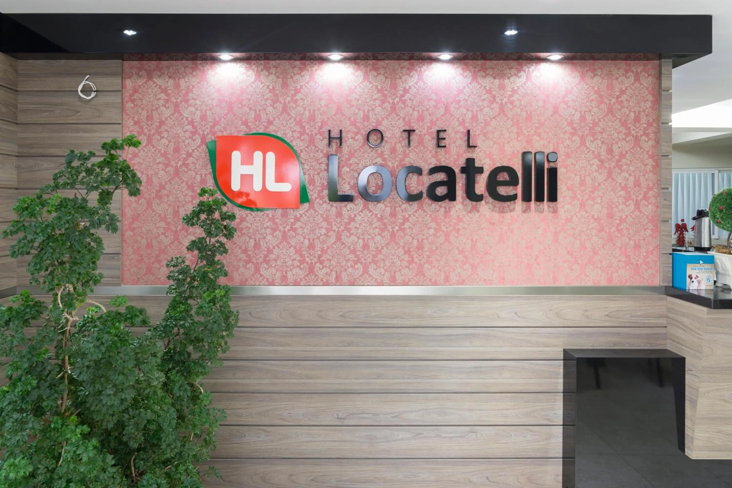 Property logo or sign in Hotel Locatelli