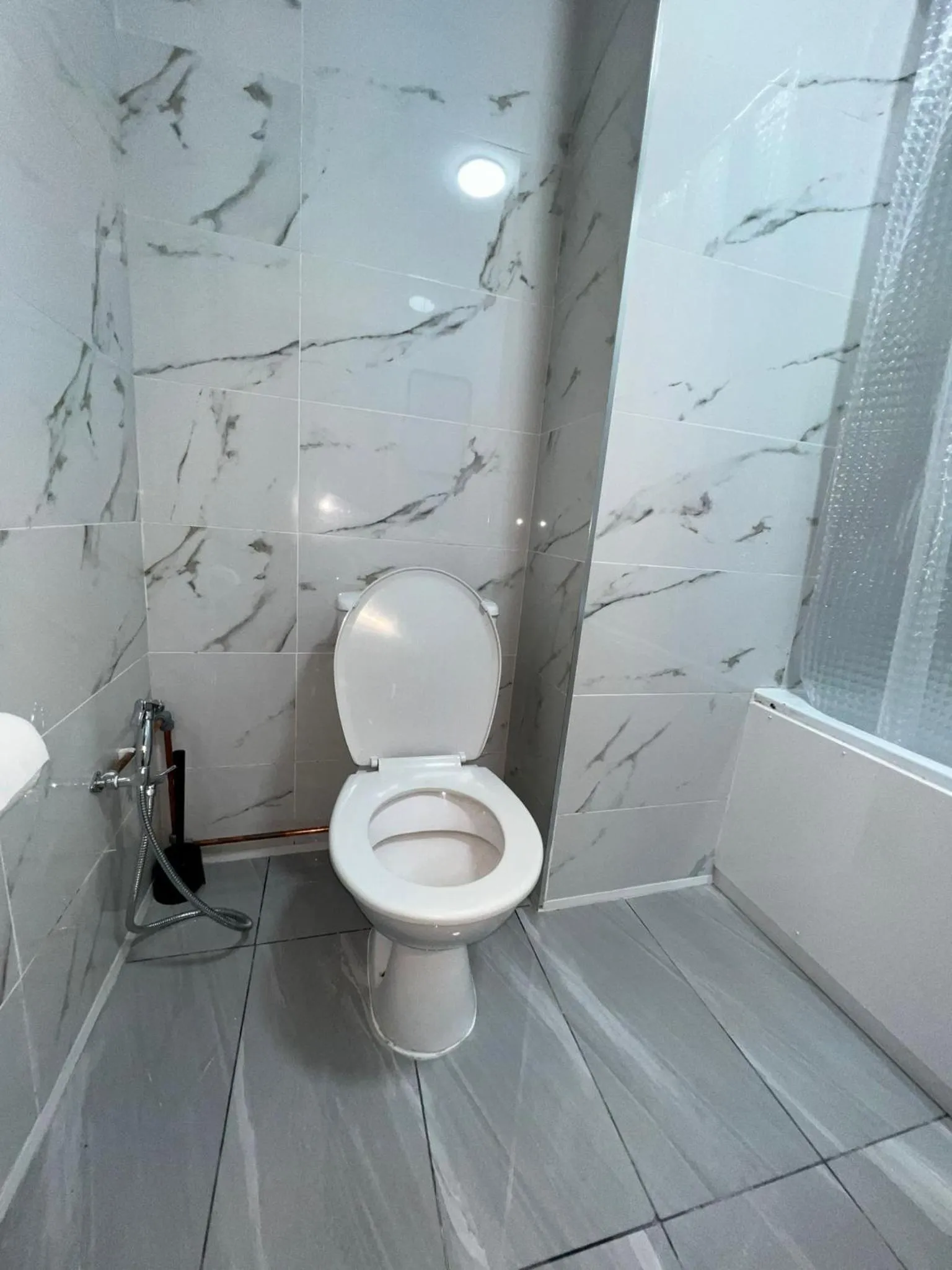 Bathroom in OYO Greenway Stays