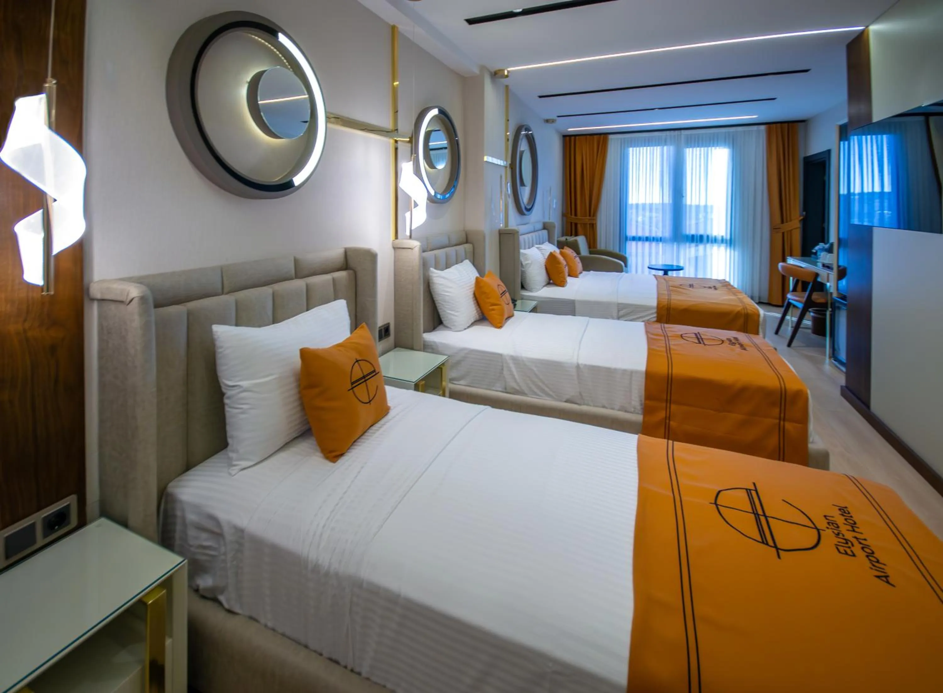 Bed in Elysian Airport Hotel & Restaurant