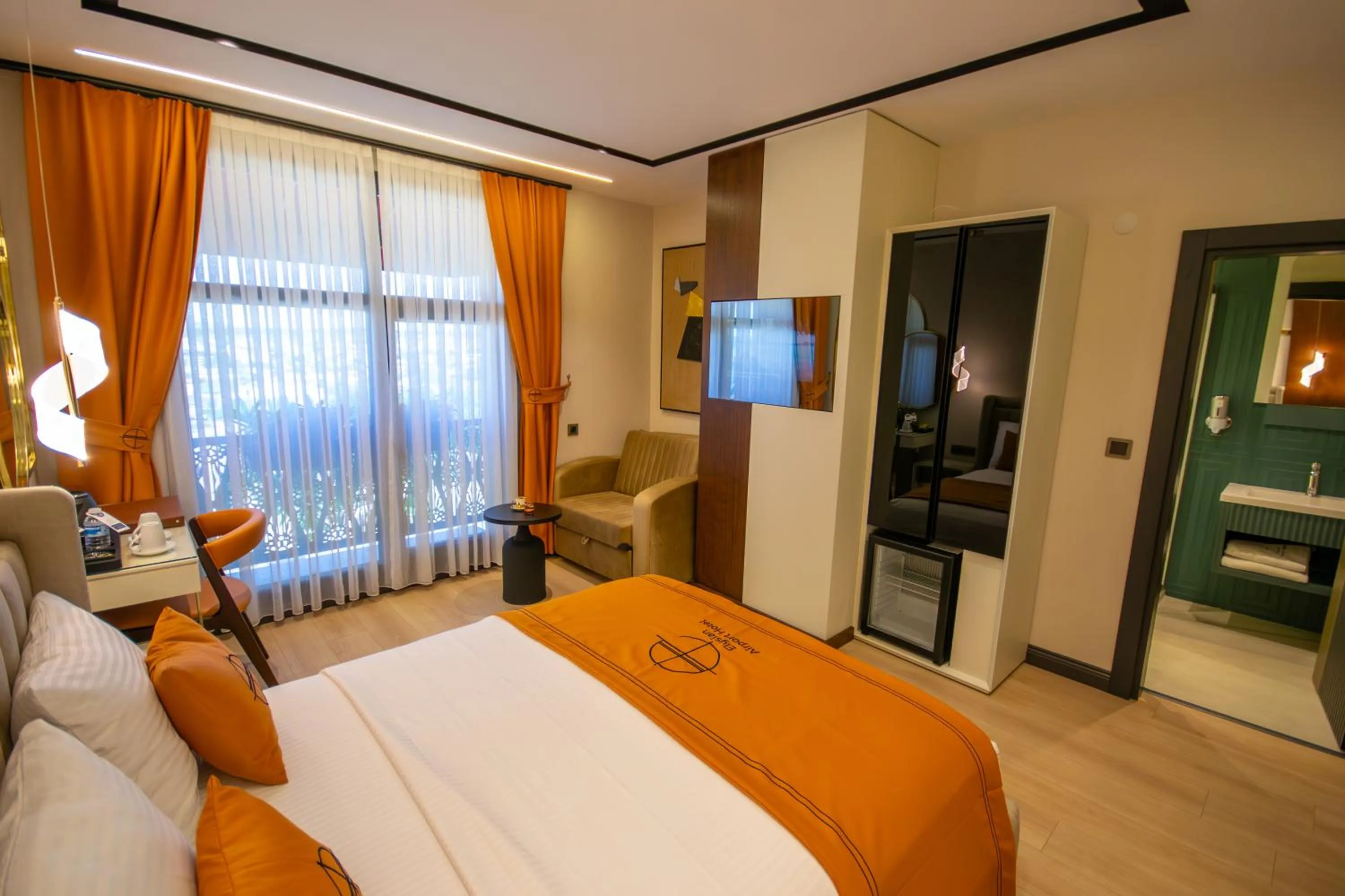 Bed in Elysian Airport Hotel & Restaurant