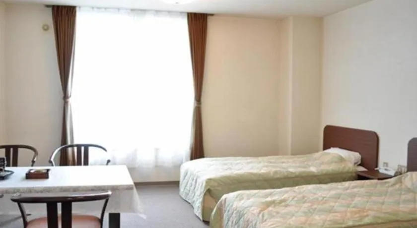 Bed in Ryobou Hanaemi Hotel