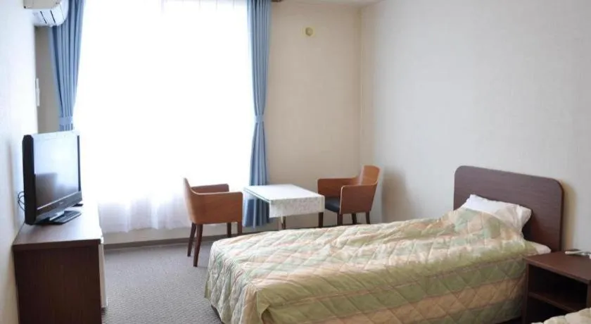 Bed in Ryobou Hanaemi Hotel