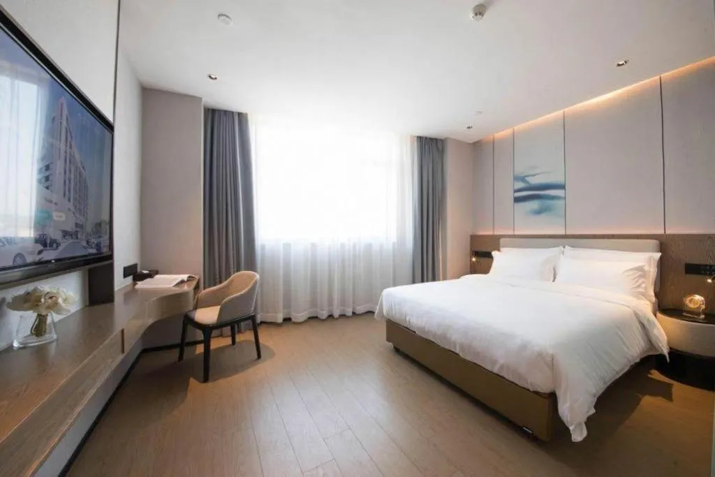 Bed in Yian Business Hotel