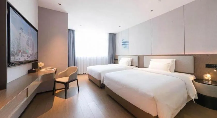 Bed in Yian Business Hotel