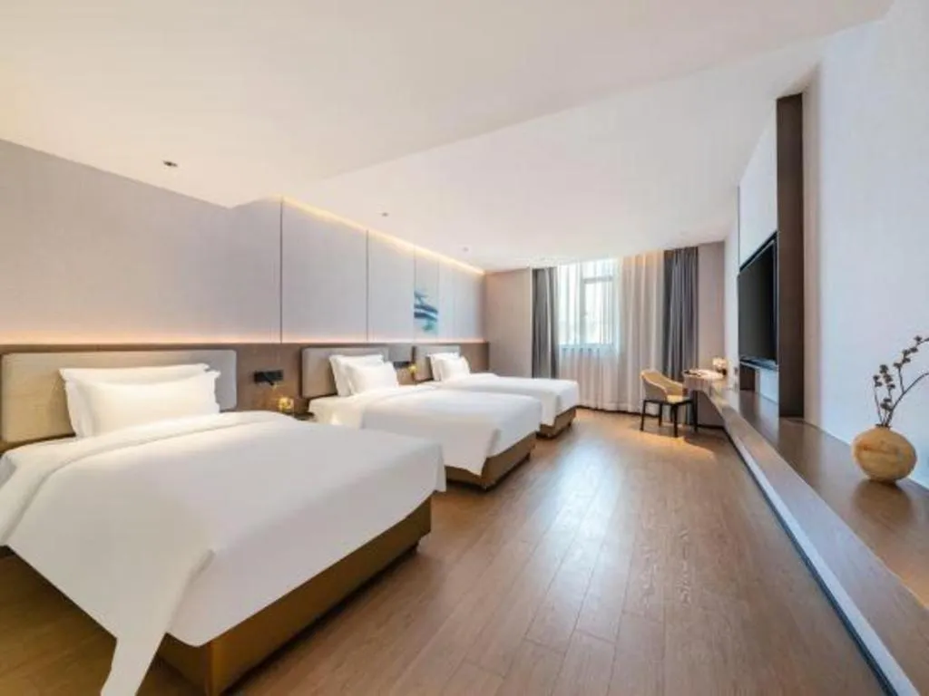 Bed in Yian Business Hotel