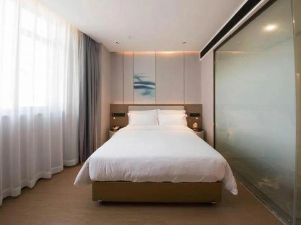 Bed in Yian Business Hotel