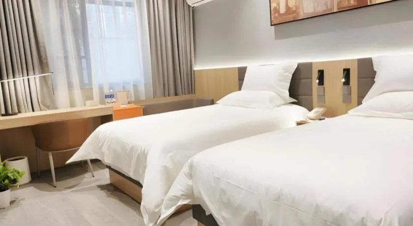 Bed in Jinjiang Inn Wuxi Liangqing Road Wanda Plaza Yunhe Bay Industrial Center